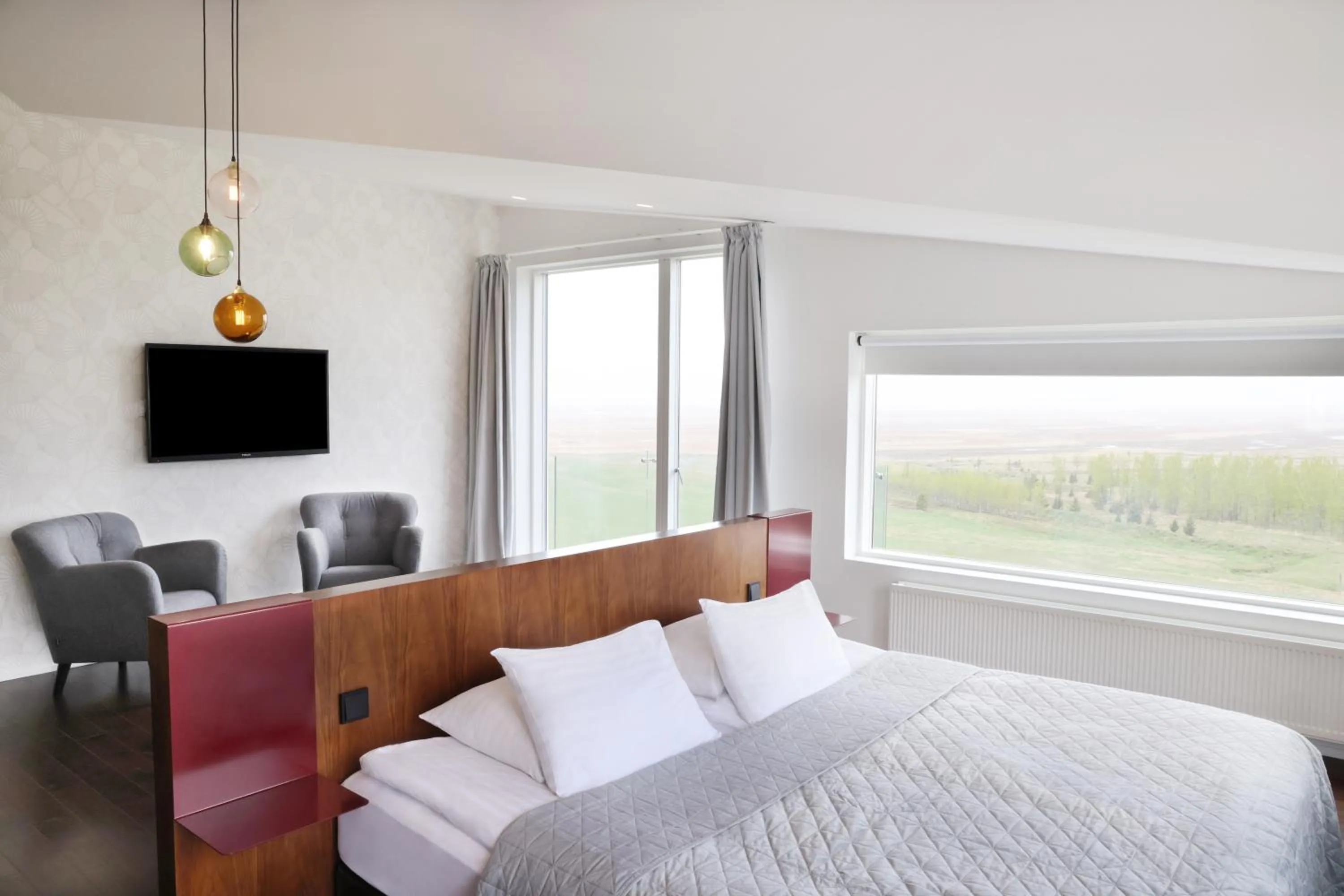 Communal lounge/ TV room, Bed in Fosshotel Vatnajökull