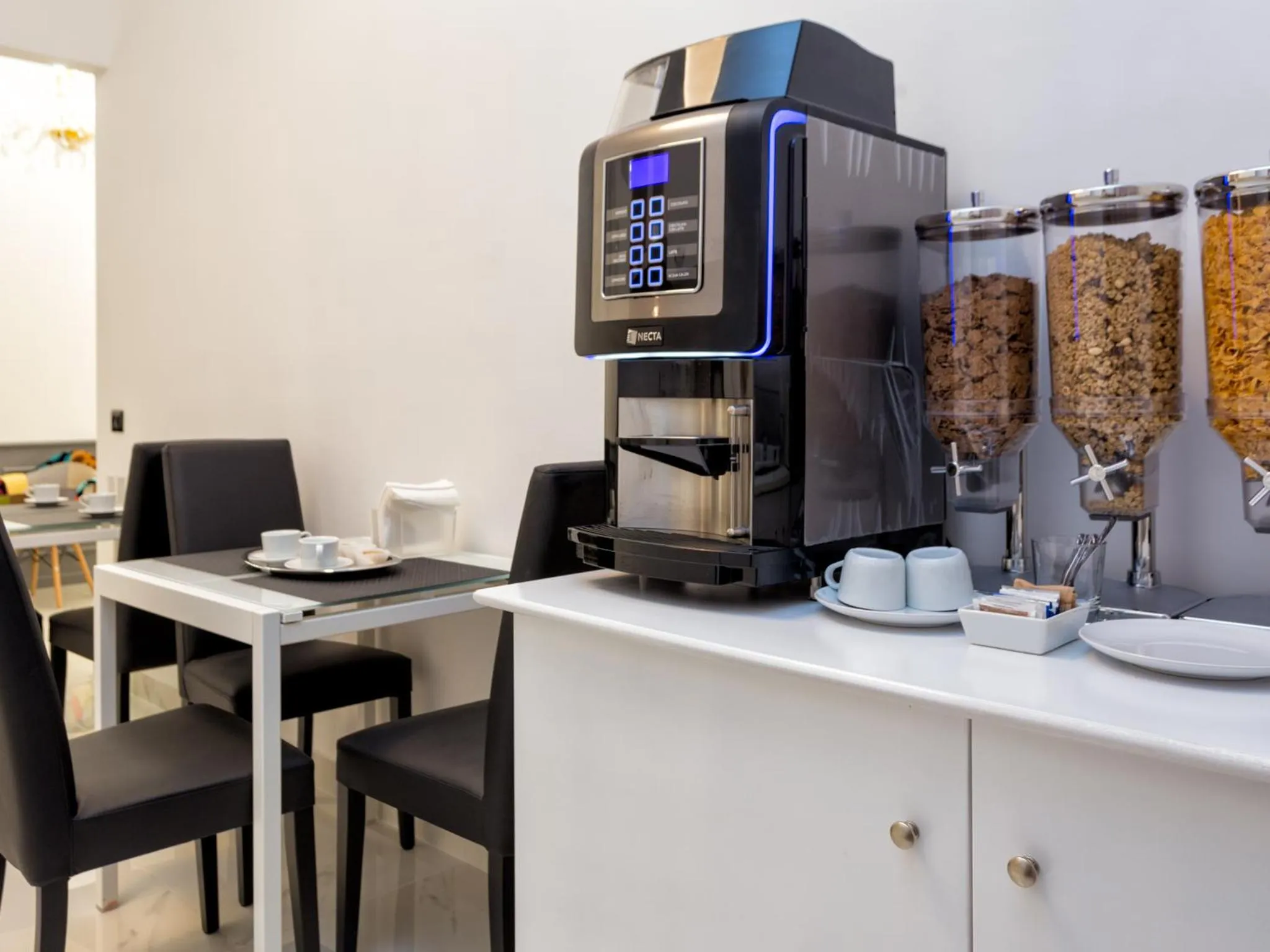 Communal lounge/ TV room in Queen Palace Suites