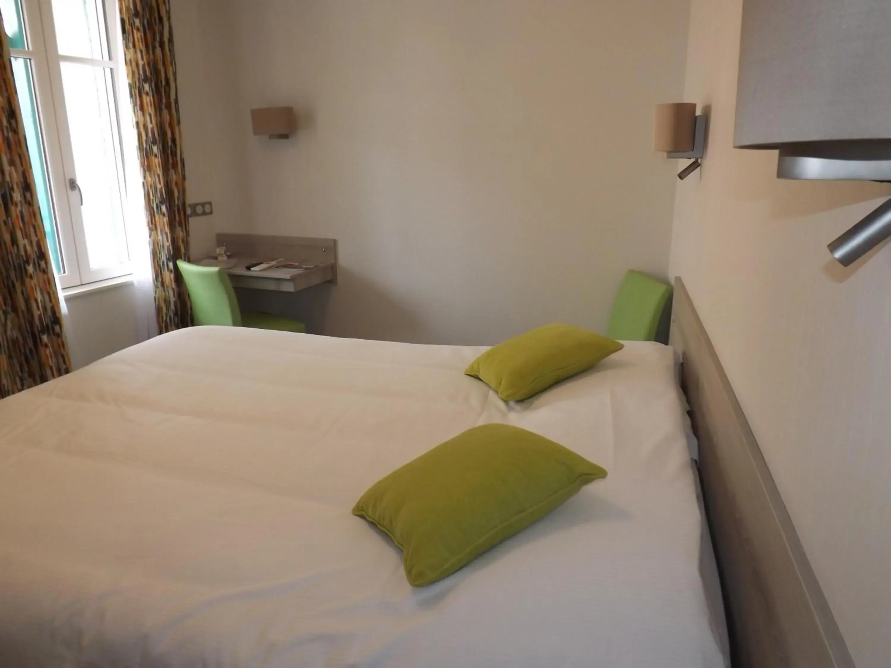 Bed in Logis Hotel Le Parc Bed in Logis Hotel Le Parc