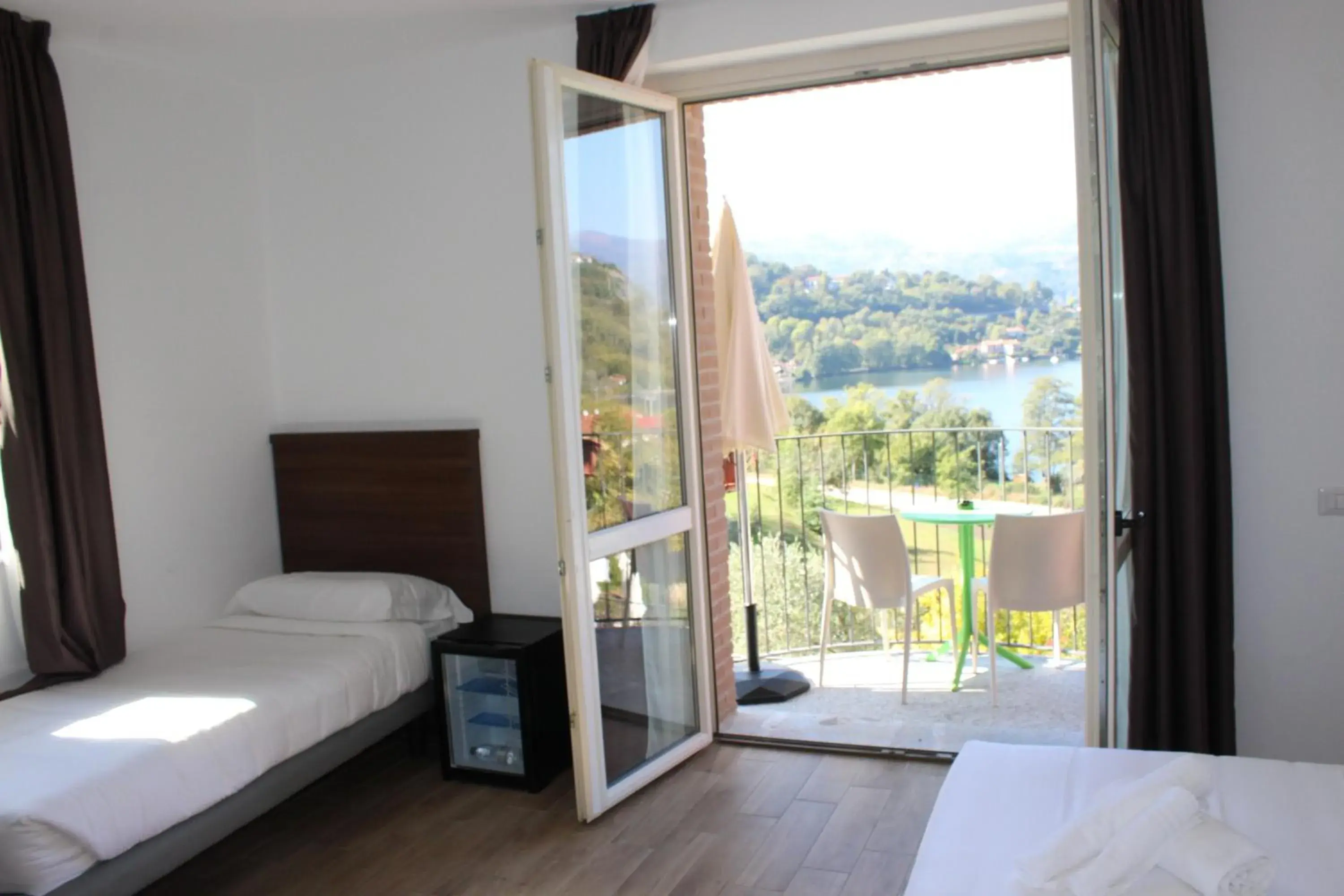 Triple Room with Balcony and Lake View in Hotel Bocciolo Triple Room with Balcony and Lake View in Hotel Bocciolo