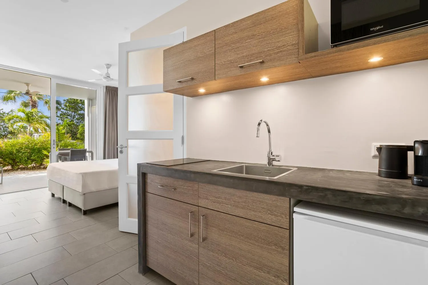 Bed in Delfins Beach Resort Bonaire, Tapestry Collection by Hilton