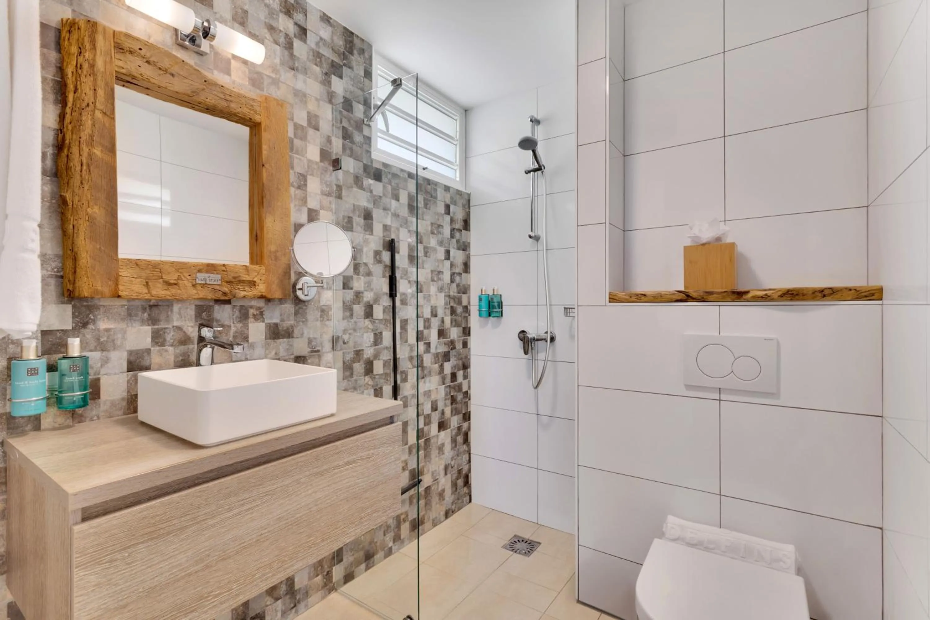 Bathroom in Delfins Beach Resort Bonaire, Tapestry Collection by Hilton