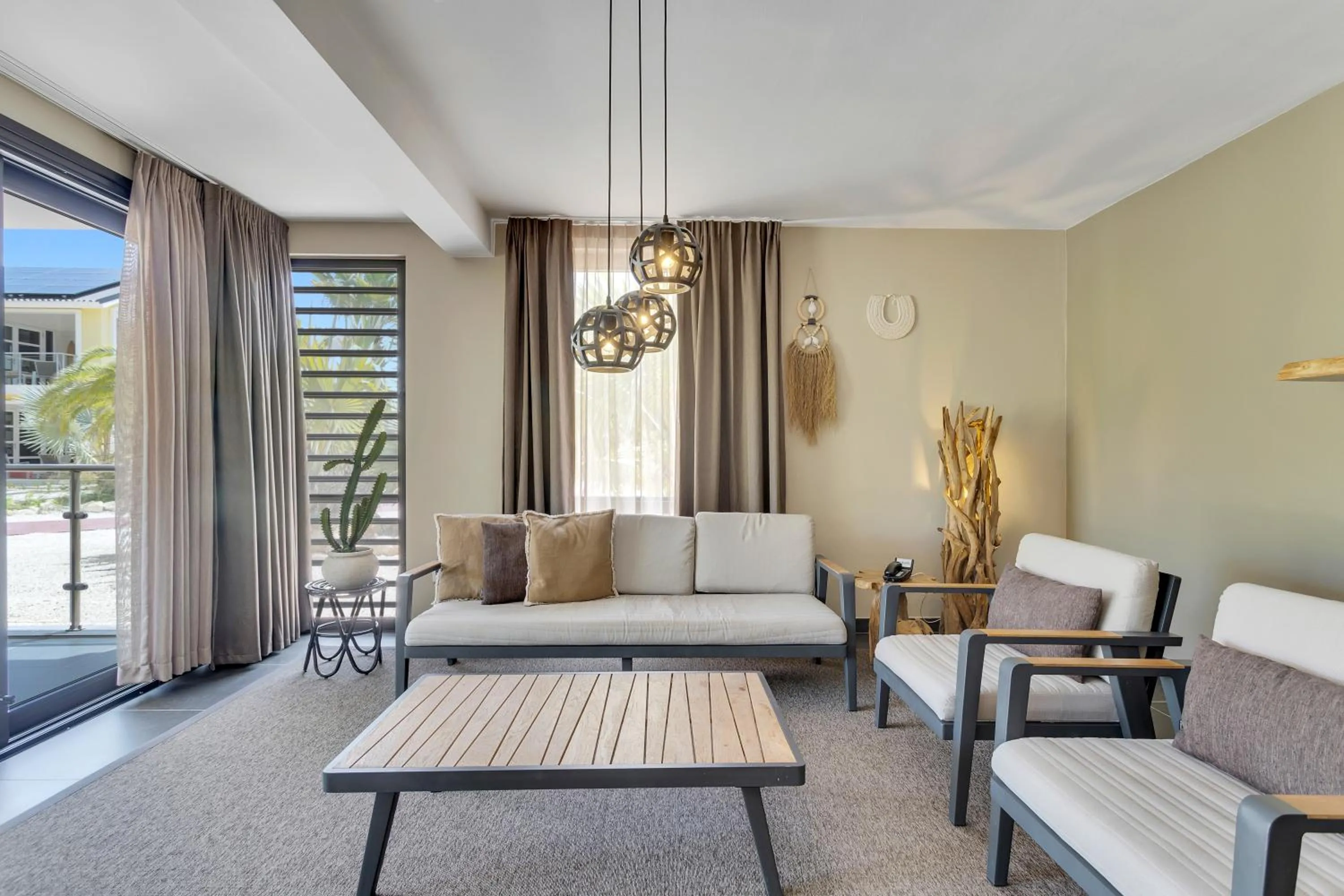 Living room in Delfins Beach Resort Bonaire, Tapestry Collection by Hilton