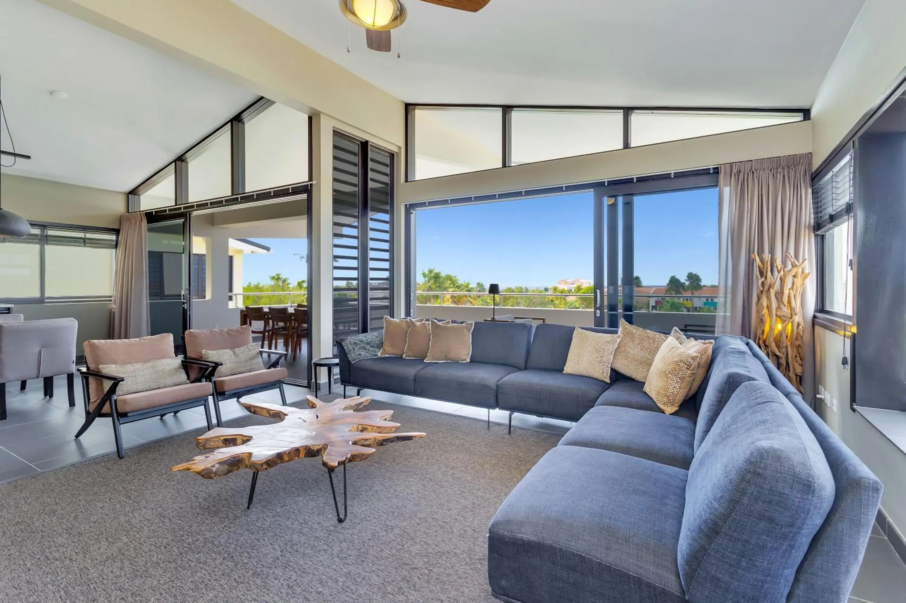 Living room in Delfins Beach Resort Bonaire, Tapestry Collection by Hilton Living room in Delfins Beach Resort Bonaire, Tapestry Collection by Hilton