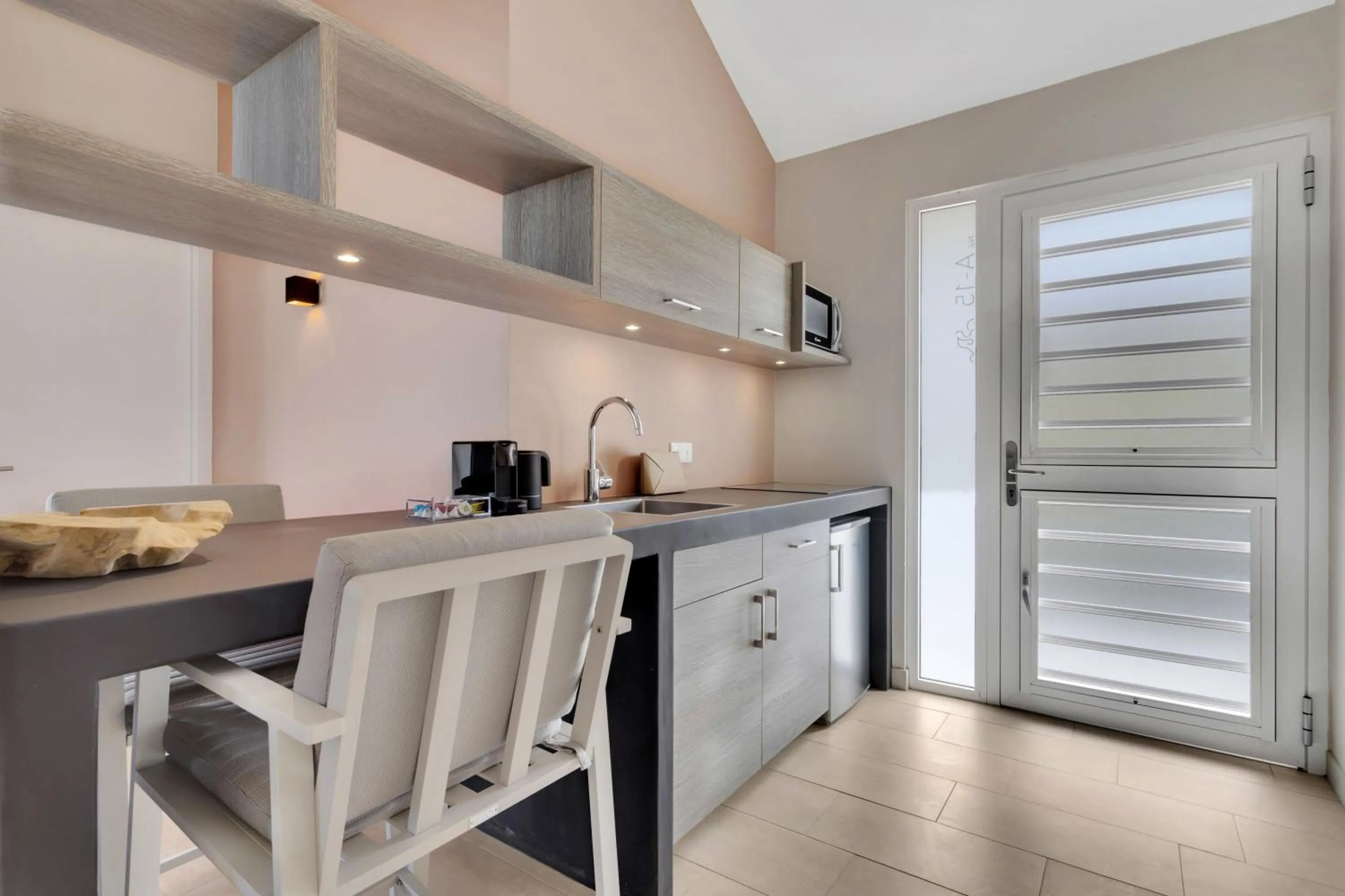 Kitchen or kitchenette in Delfins Beach Resort Bonaire, Tapestry Collection by Hilton