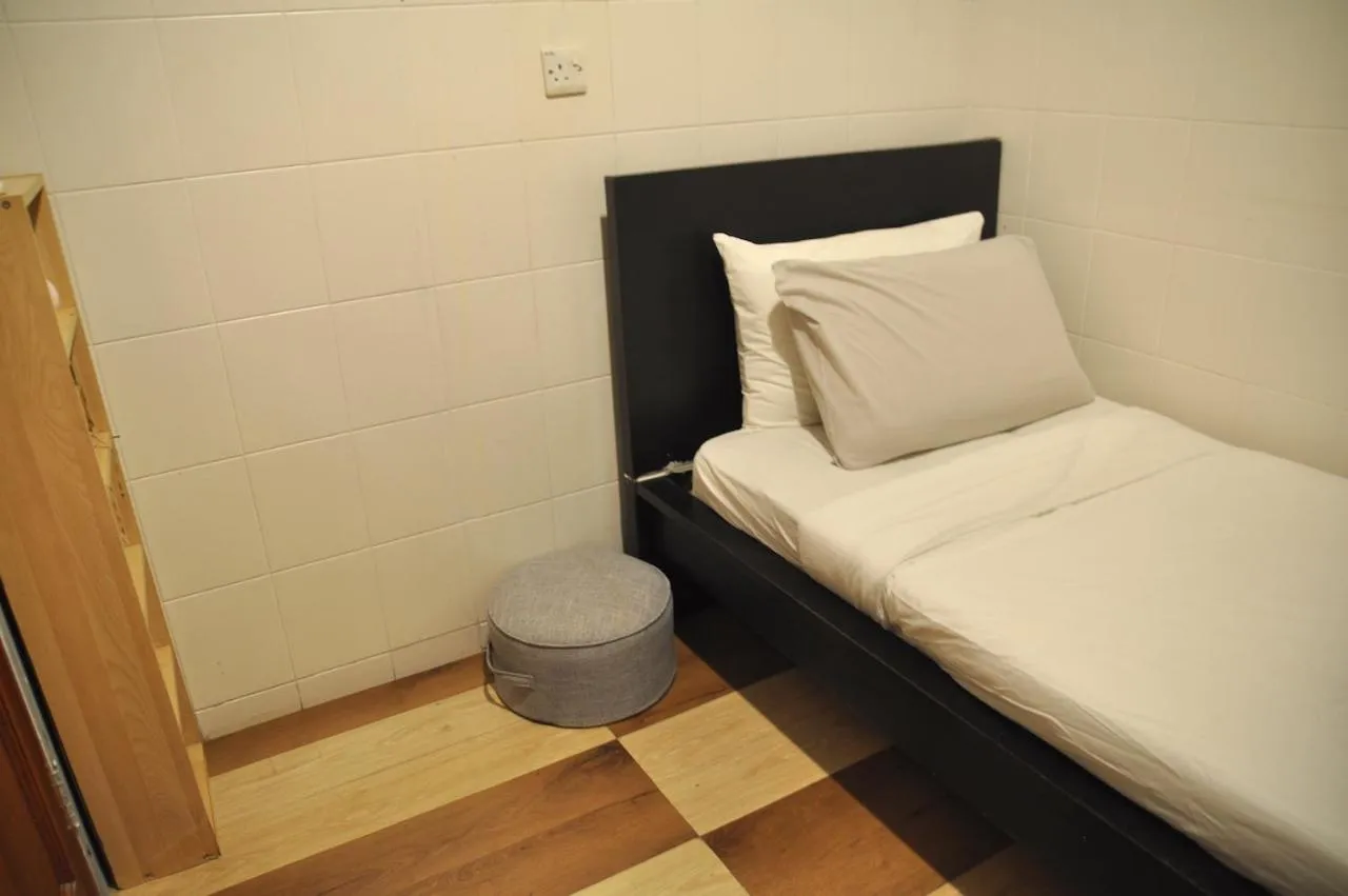 Bed in GRAYHAUS Guest House