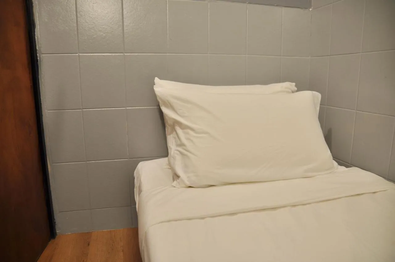 Bed in GRAYHAUS Guest House