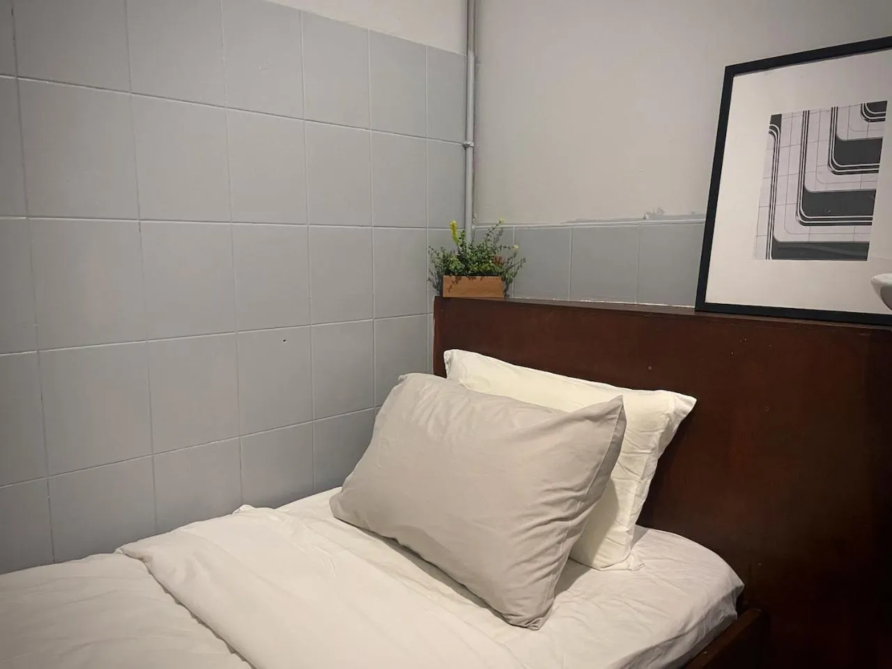 Bed in GRAYHAUS Guest House