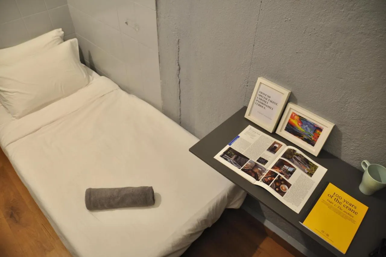 Bed in GRAYHAUS Guest House