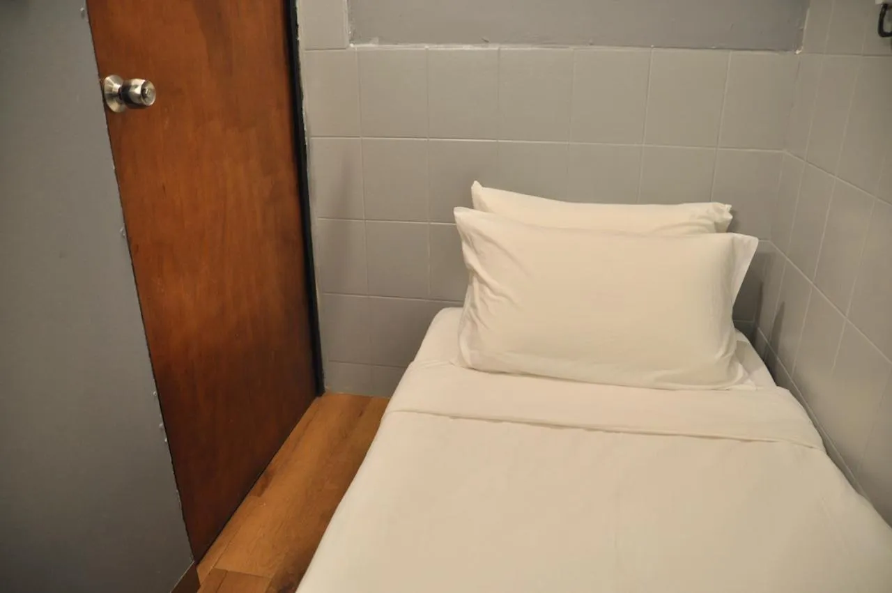 Bed in GRAYHAUS Guest House