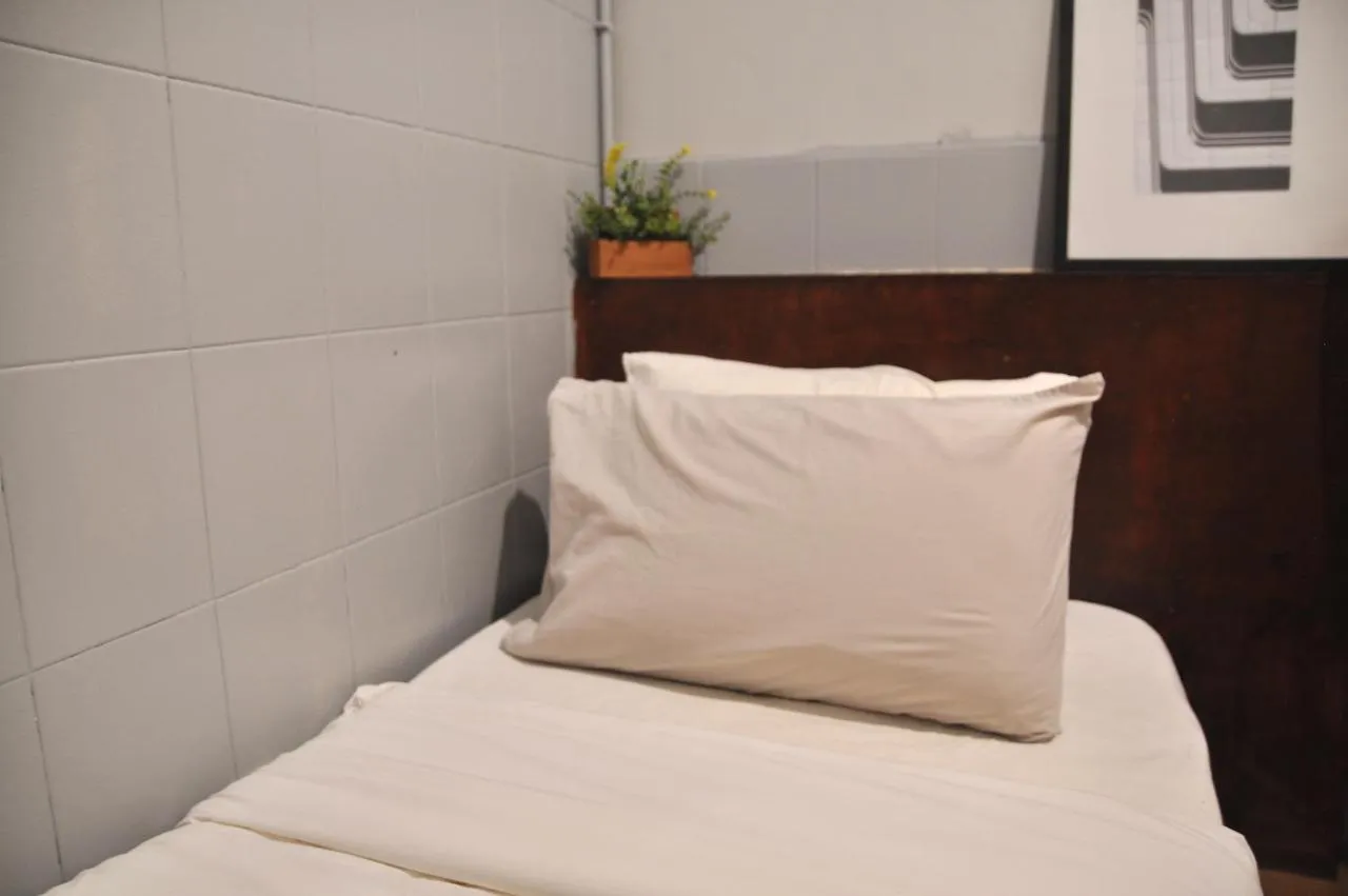 Bed in GRAYHAUS Guest House