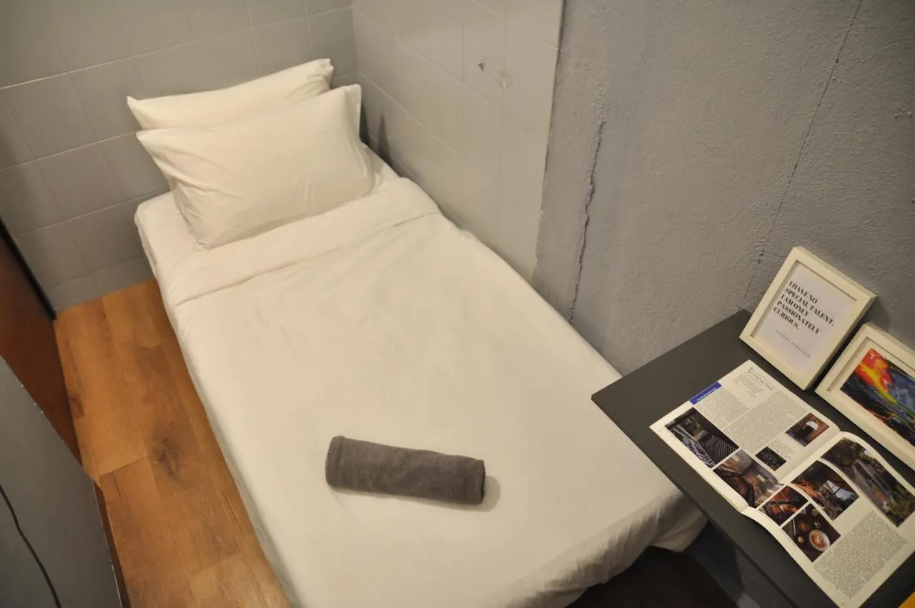 Bed in GRAYHAUS Guest House