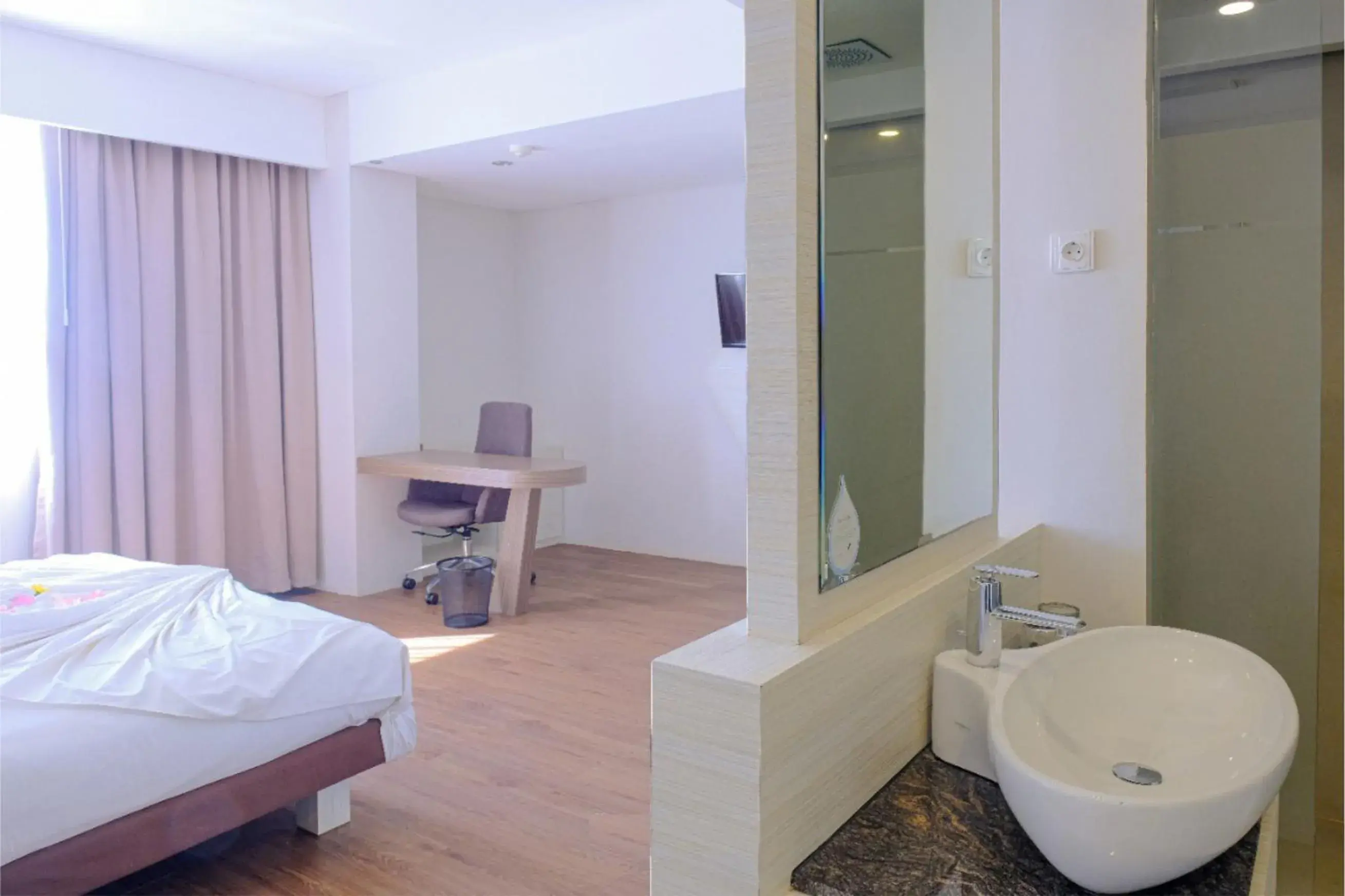 Bed, Bathroom in Royal Bay Hotel Makassar