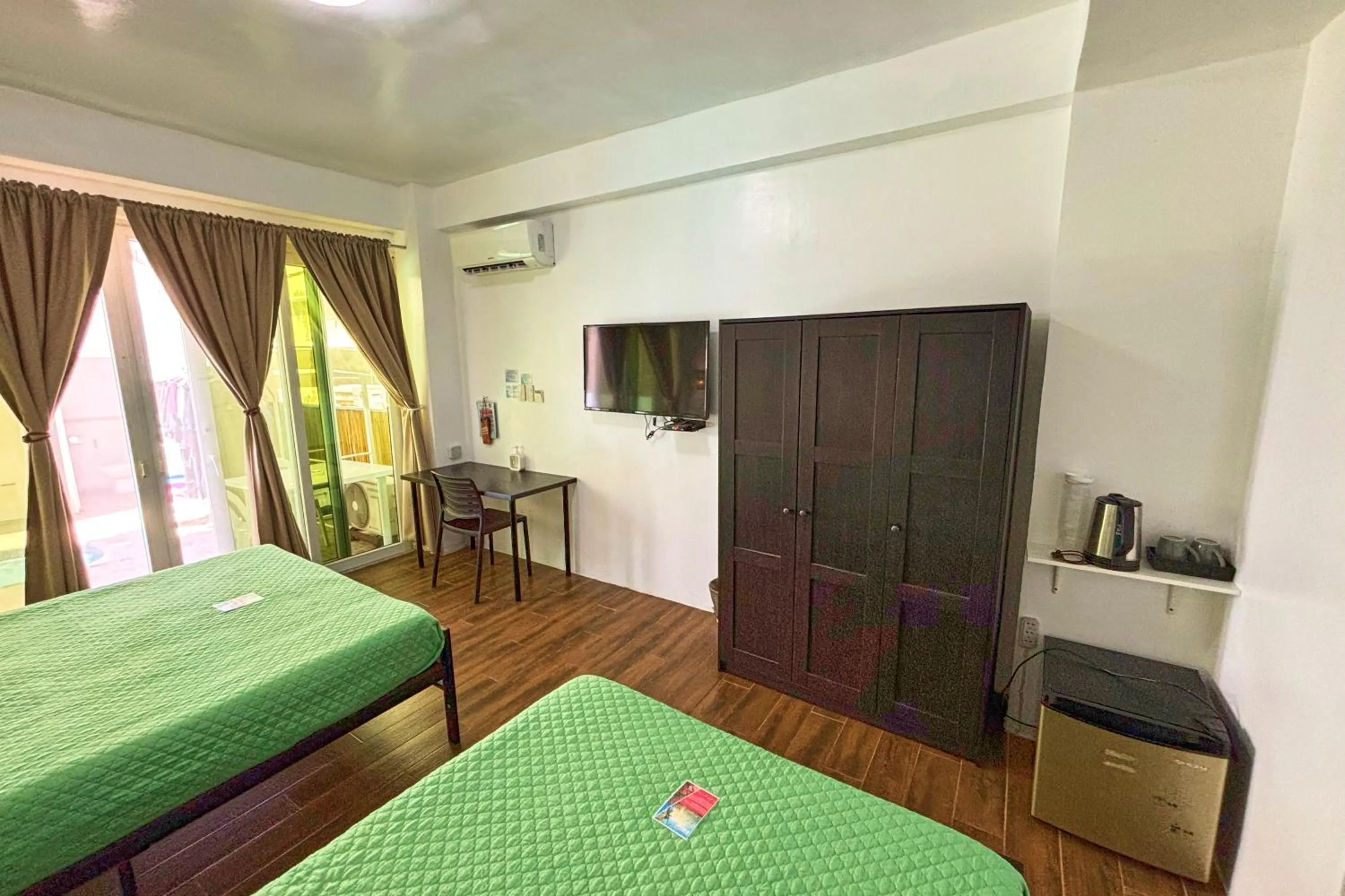 Bed in Arkipelago Divers and Beach Resort