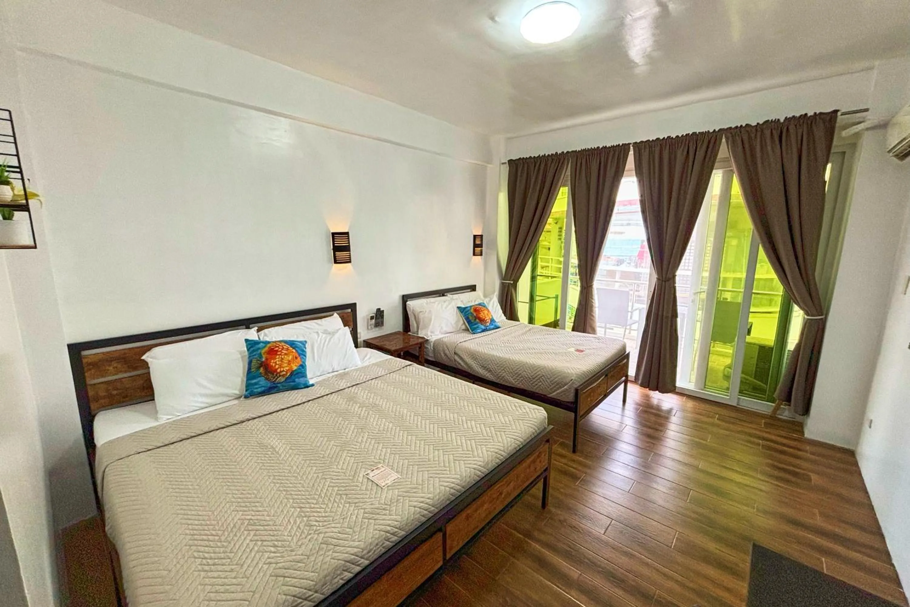 Bed in Arkipelago Divers and Beach Resort