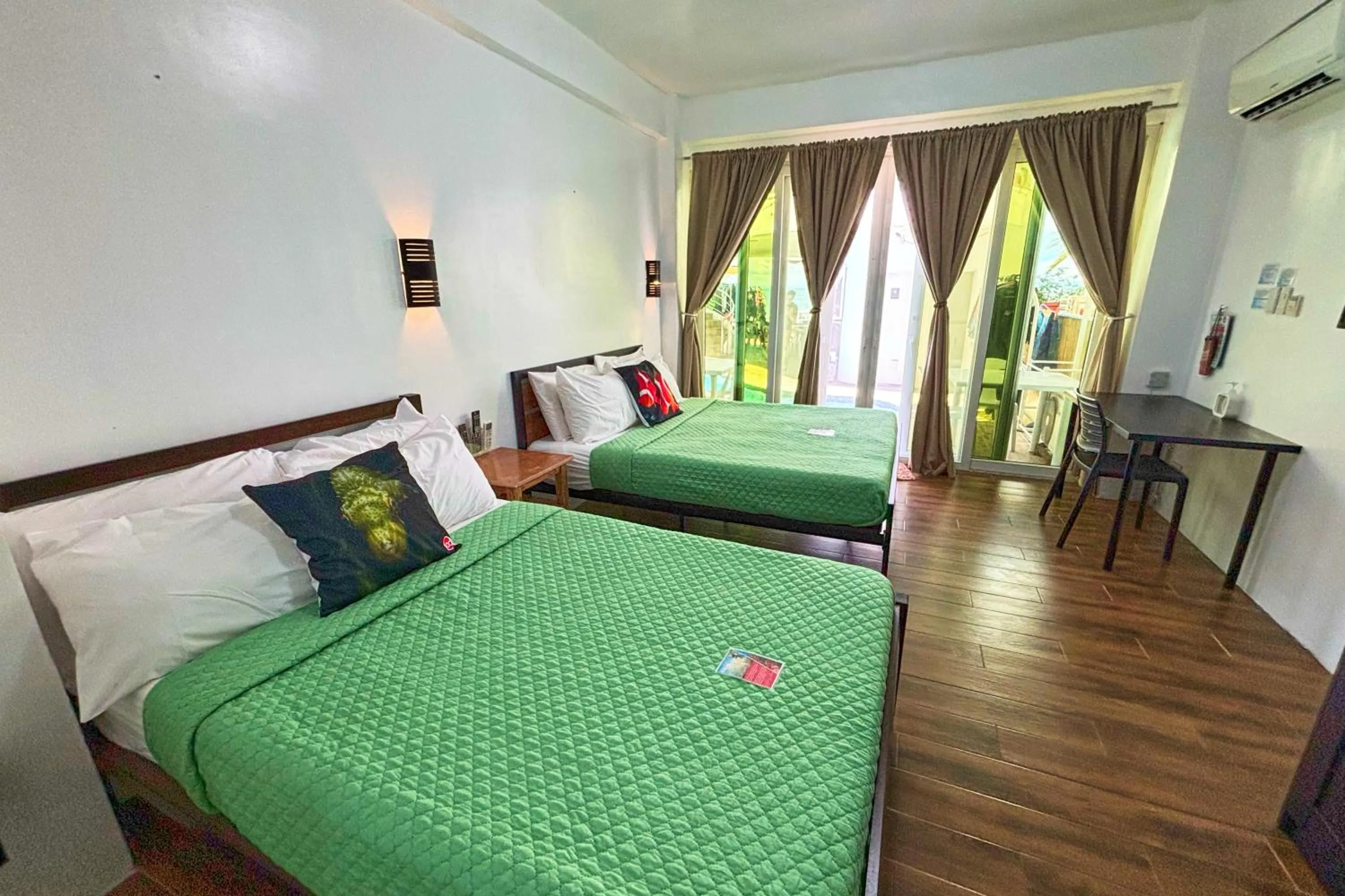 Bed in Arkipelago Divers and Beach Resort