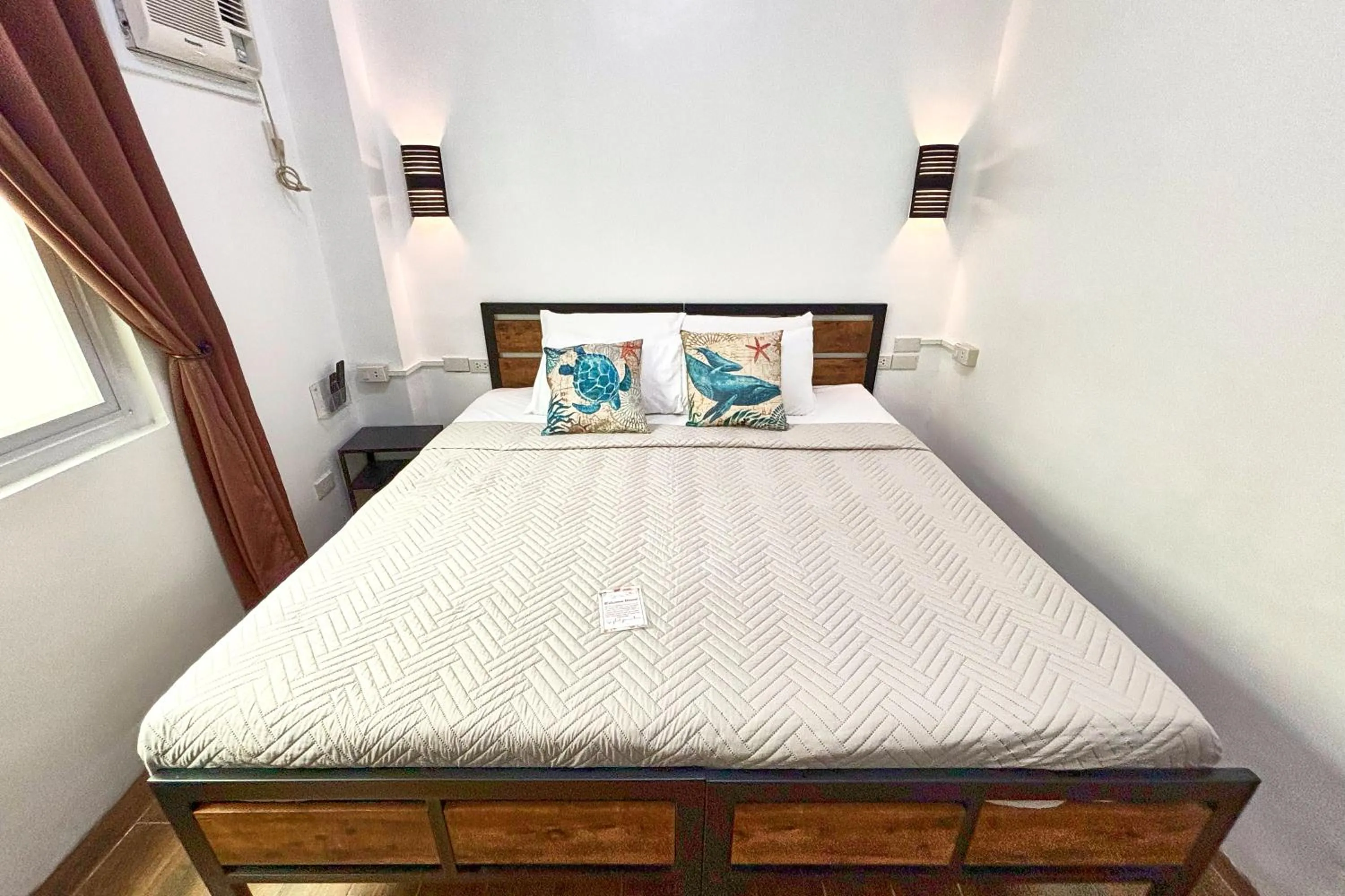 Bed in Arkipelago Divers and Beach Resort