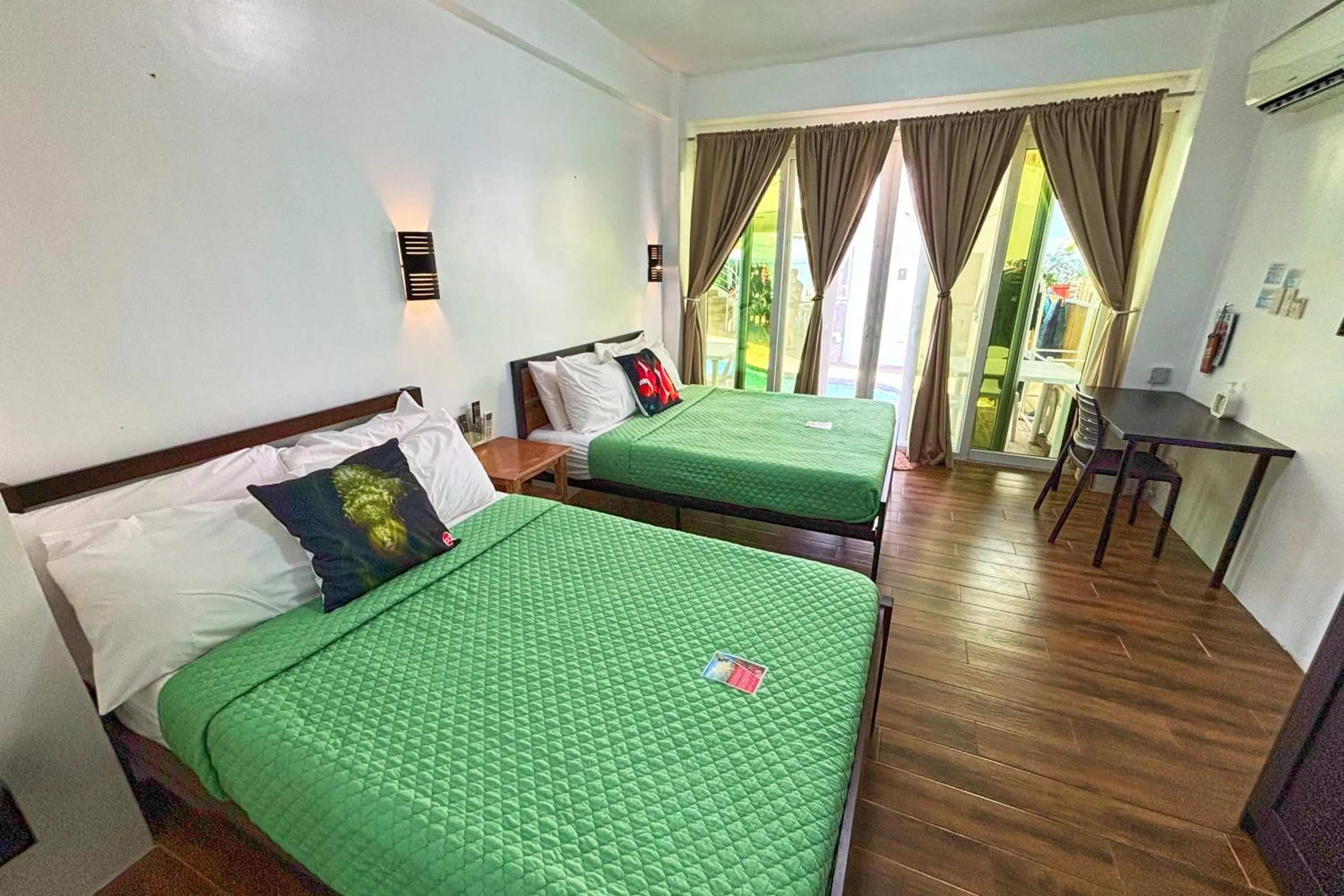 Bed in Arkipelago Divers and Beach Resort