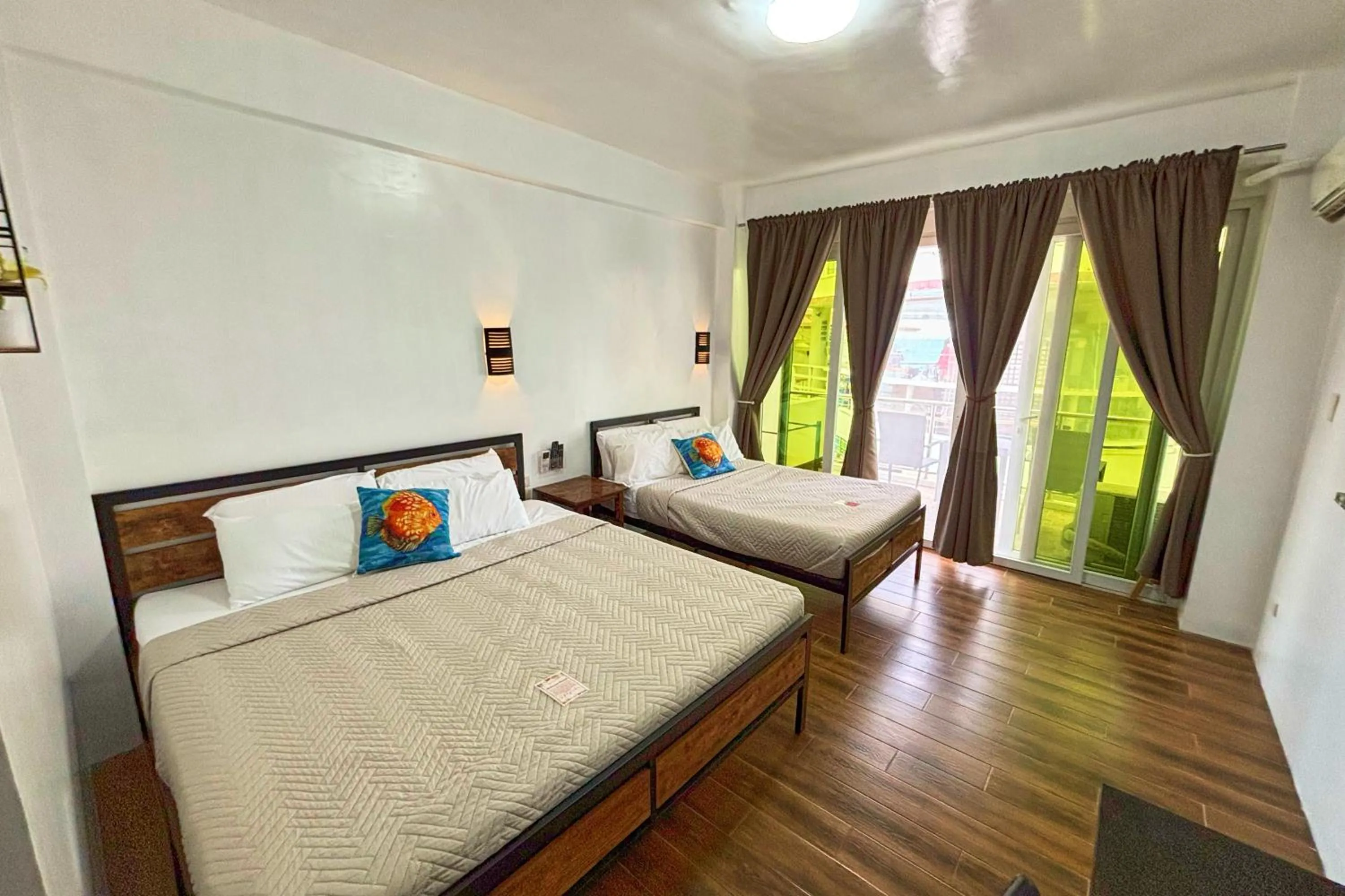 Bed in Arkipelago Divers and Beach Resort