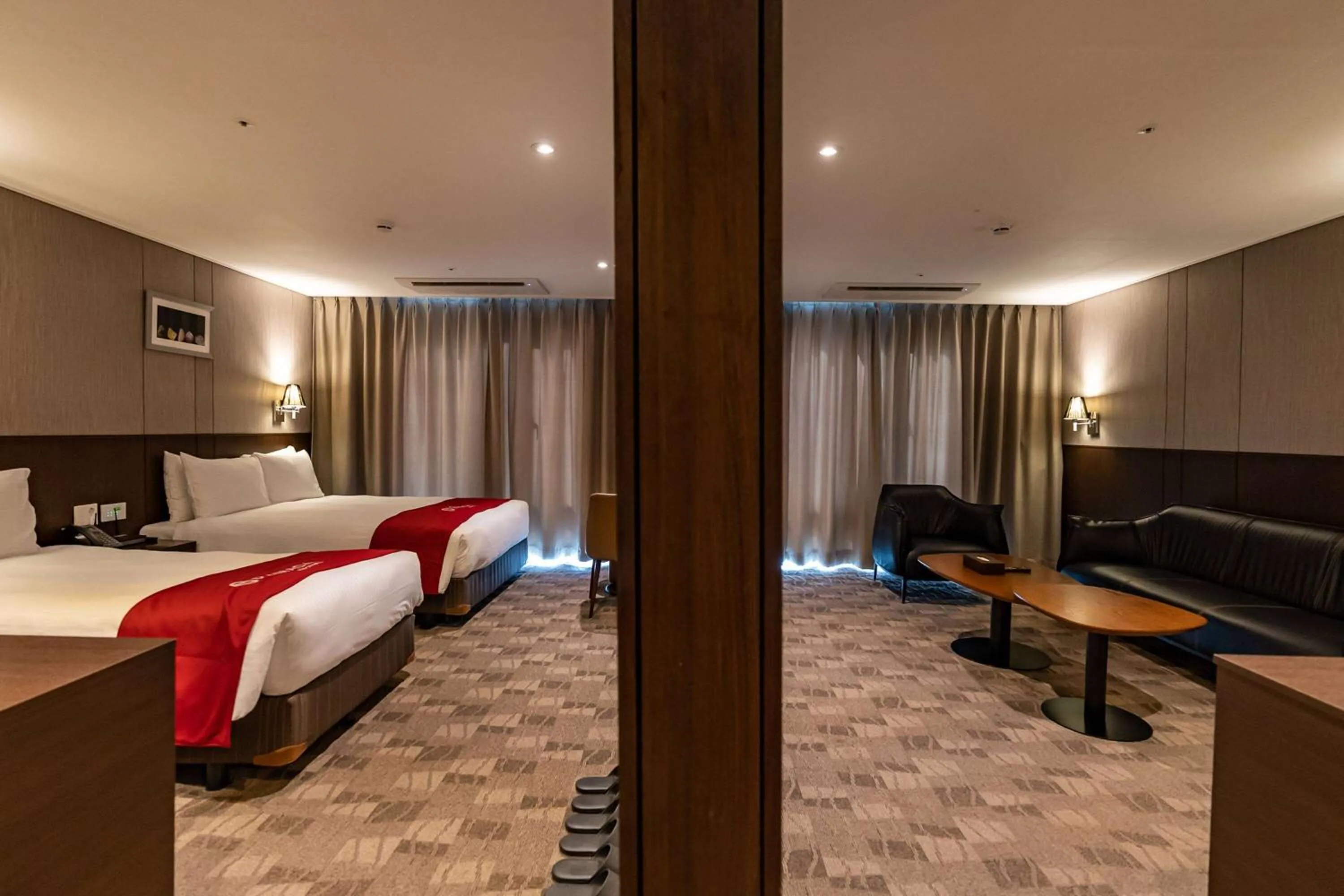 Photo of the whole room, Bed in Ramada by Wyndham Jeju City Hall