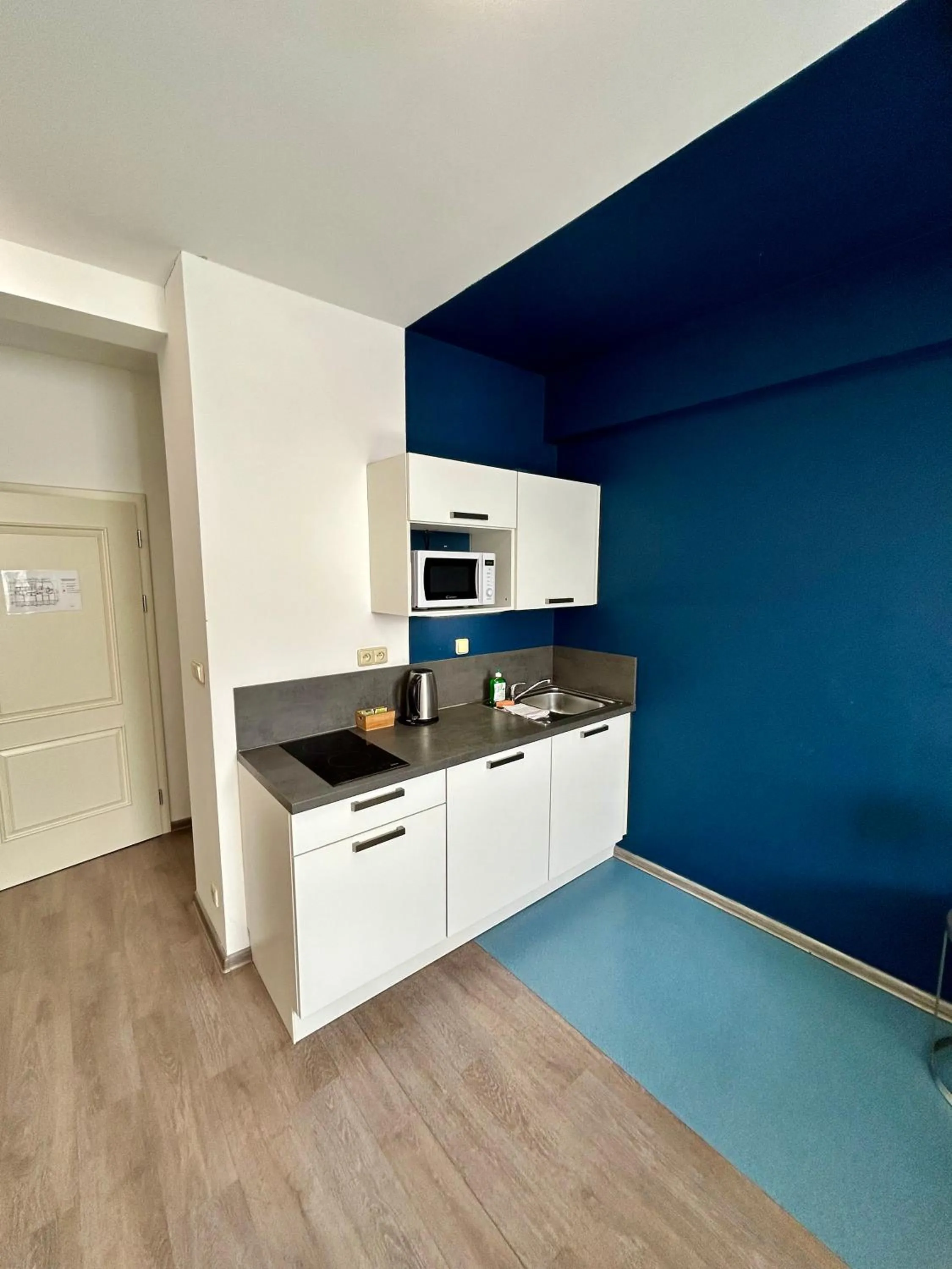 Kitchen or kitchenette in Alveo Suites