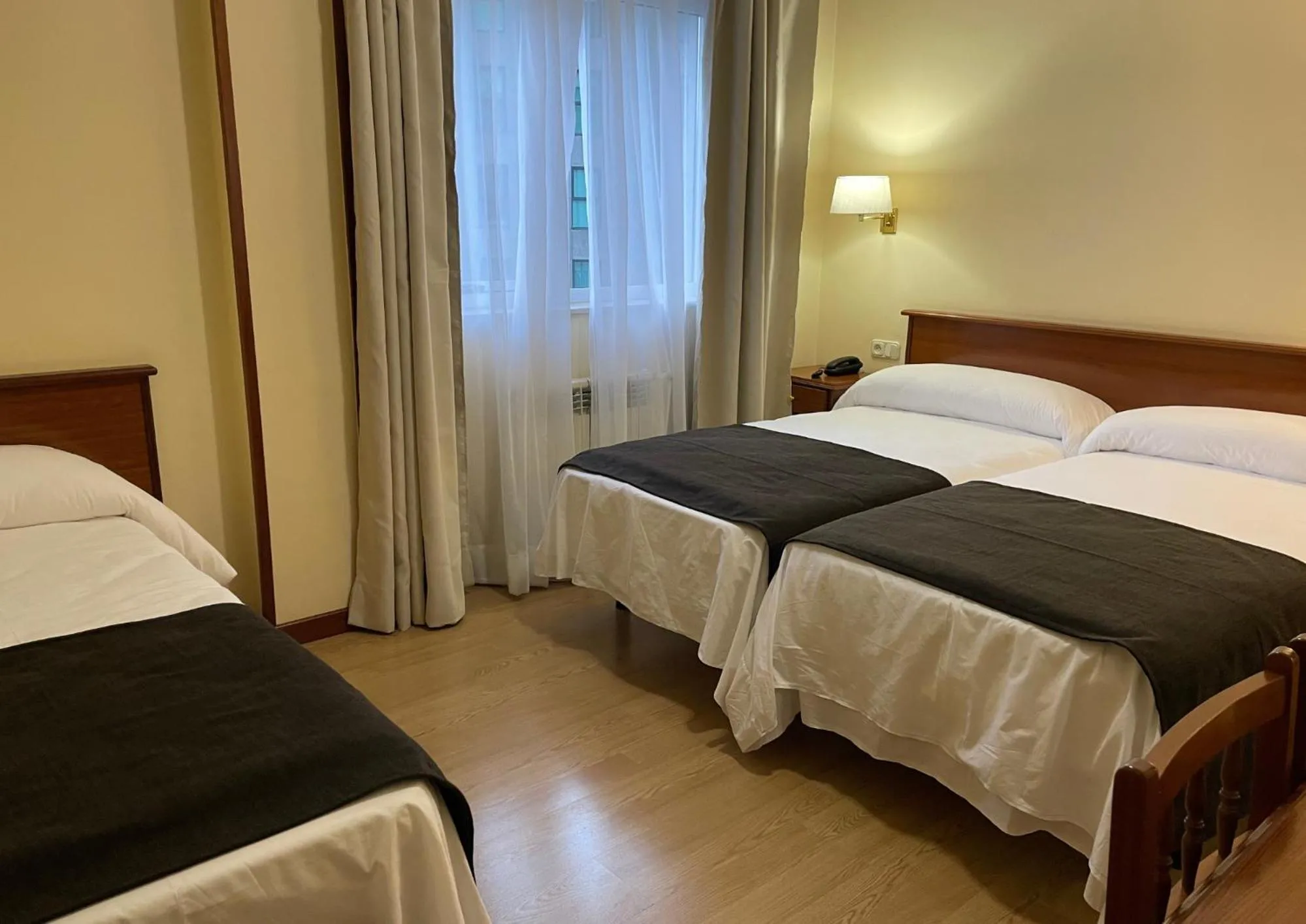 Bed in Pensión Capital de Galicia