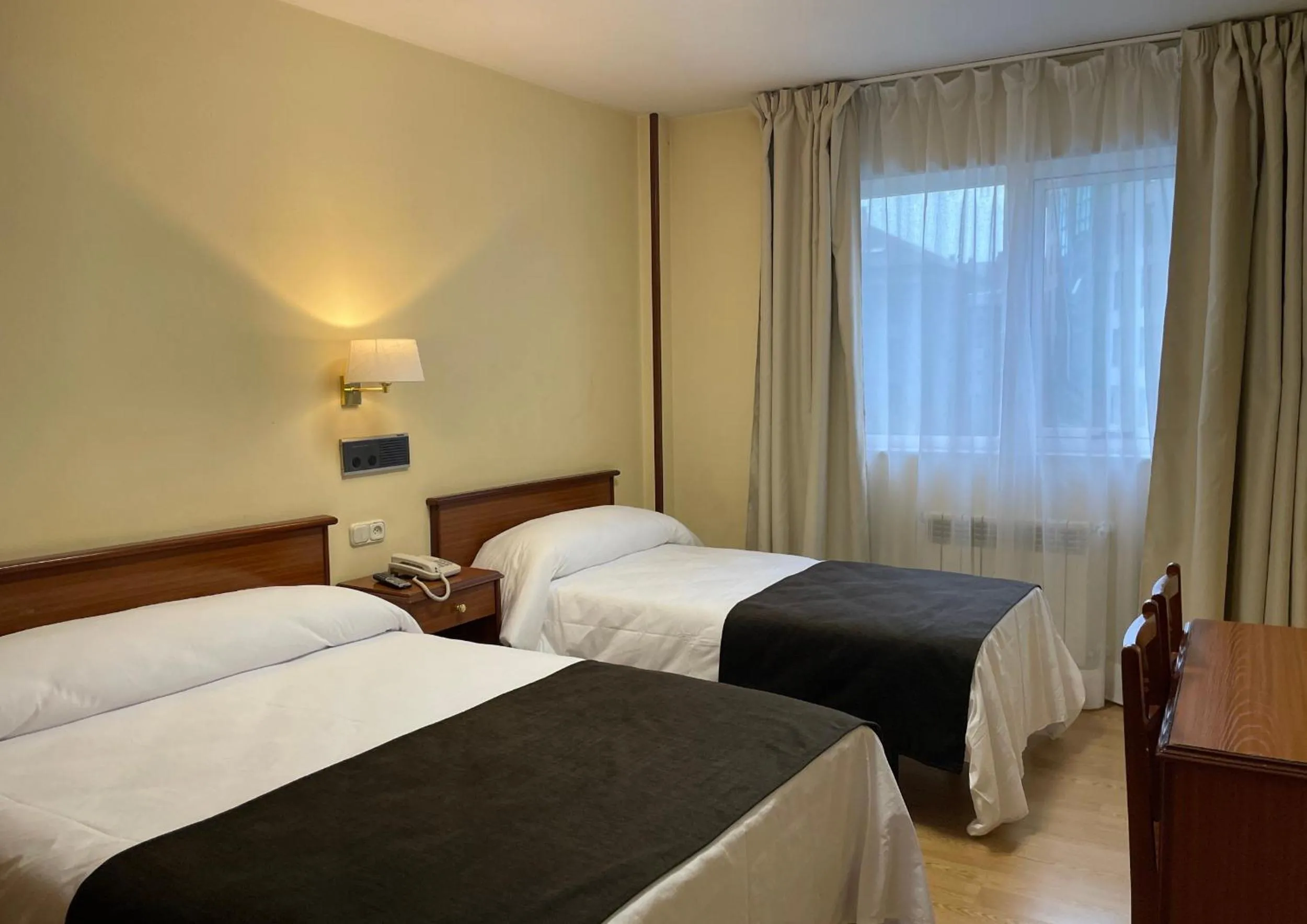 Bed in Pensión Capital de Galicia