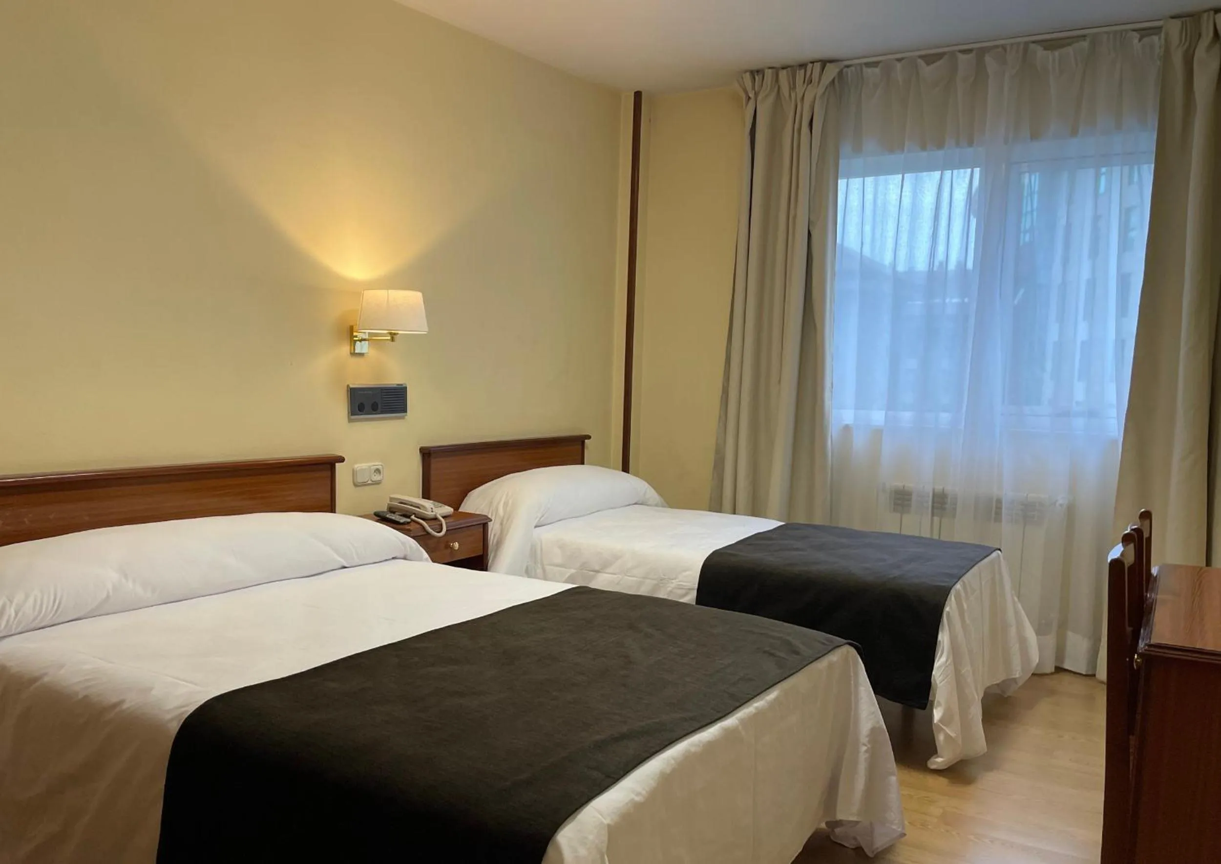 Bed in Pensión Capital de Galicia