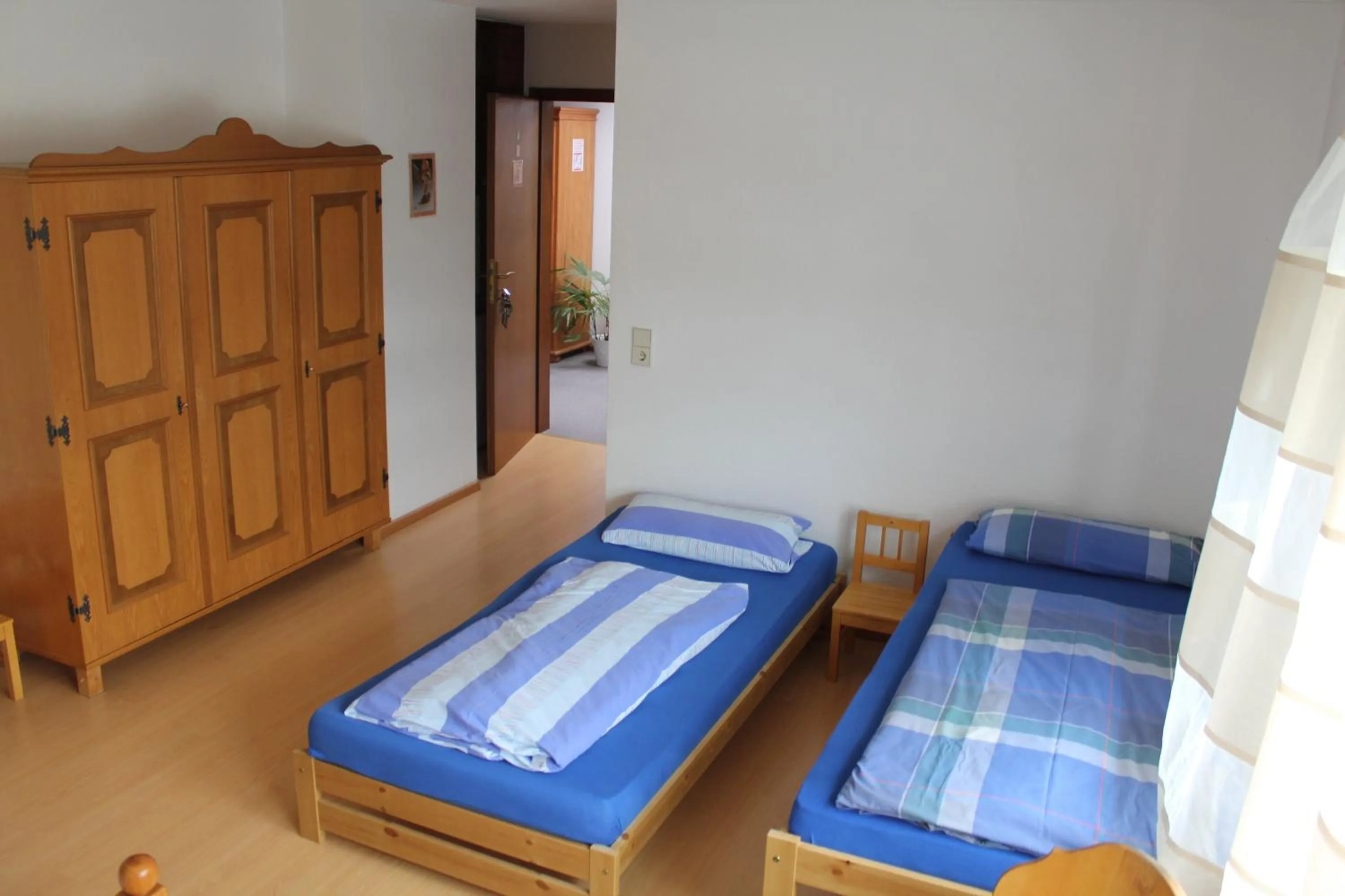 Photo of the whole room, Bed in Gasthaus Mösle