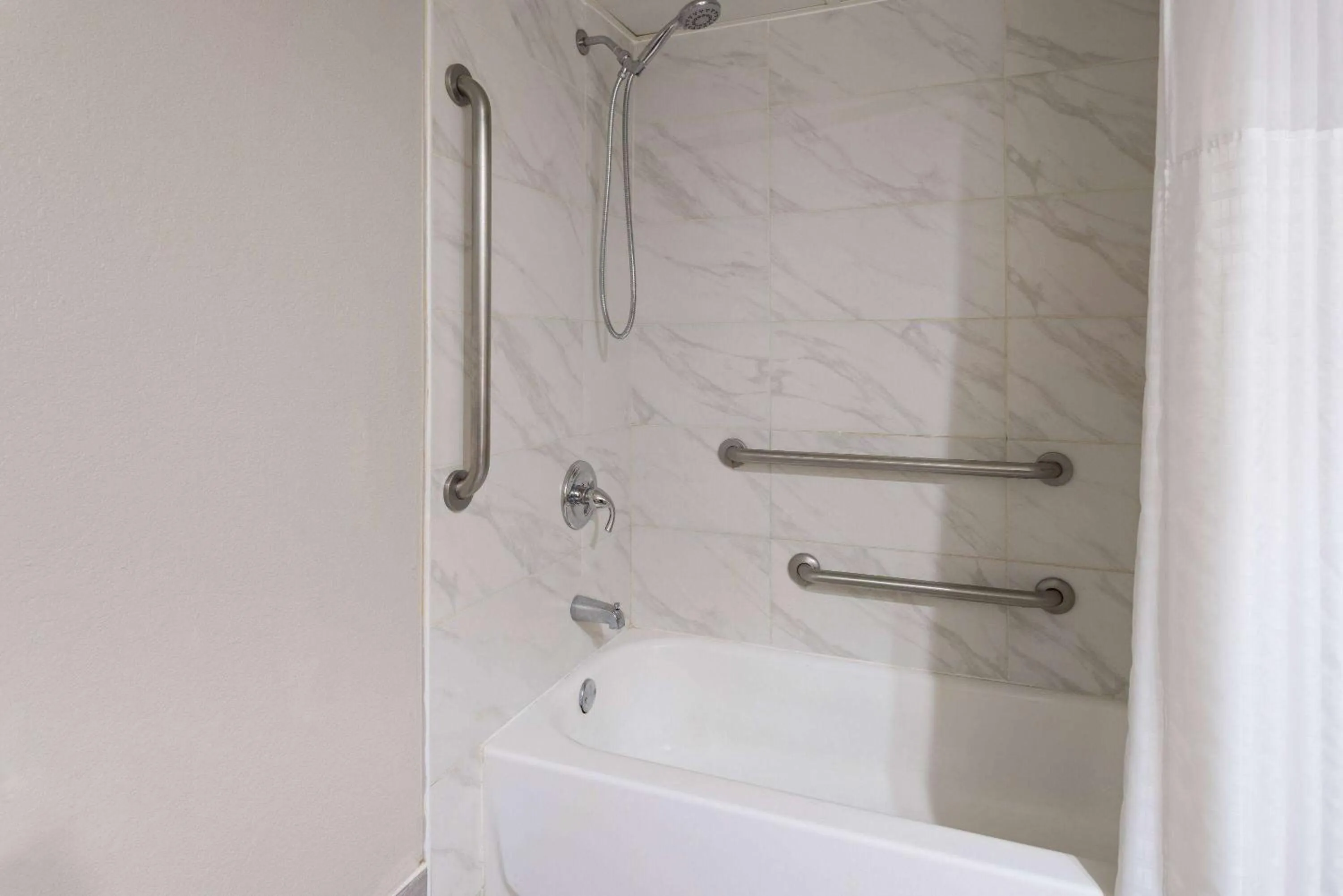 Bathroom in Days Inn & Suites by Wyndham Albany