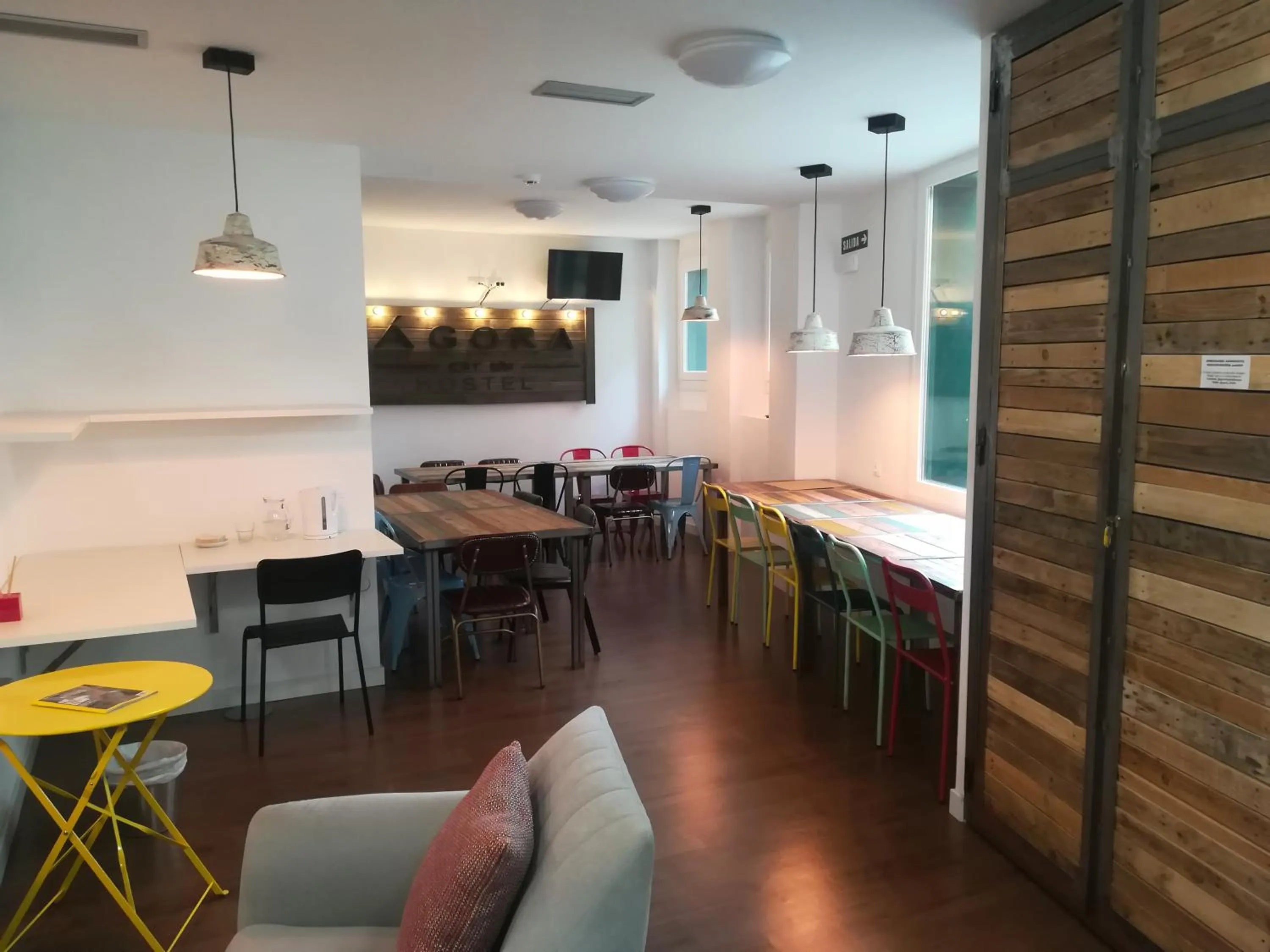 Communal lounge/ TV room in Agora Hostel