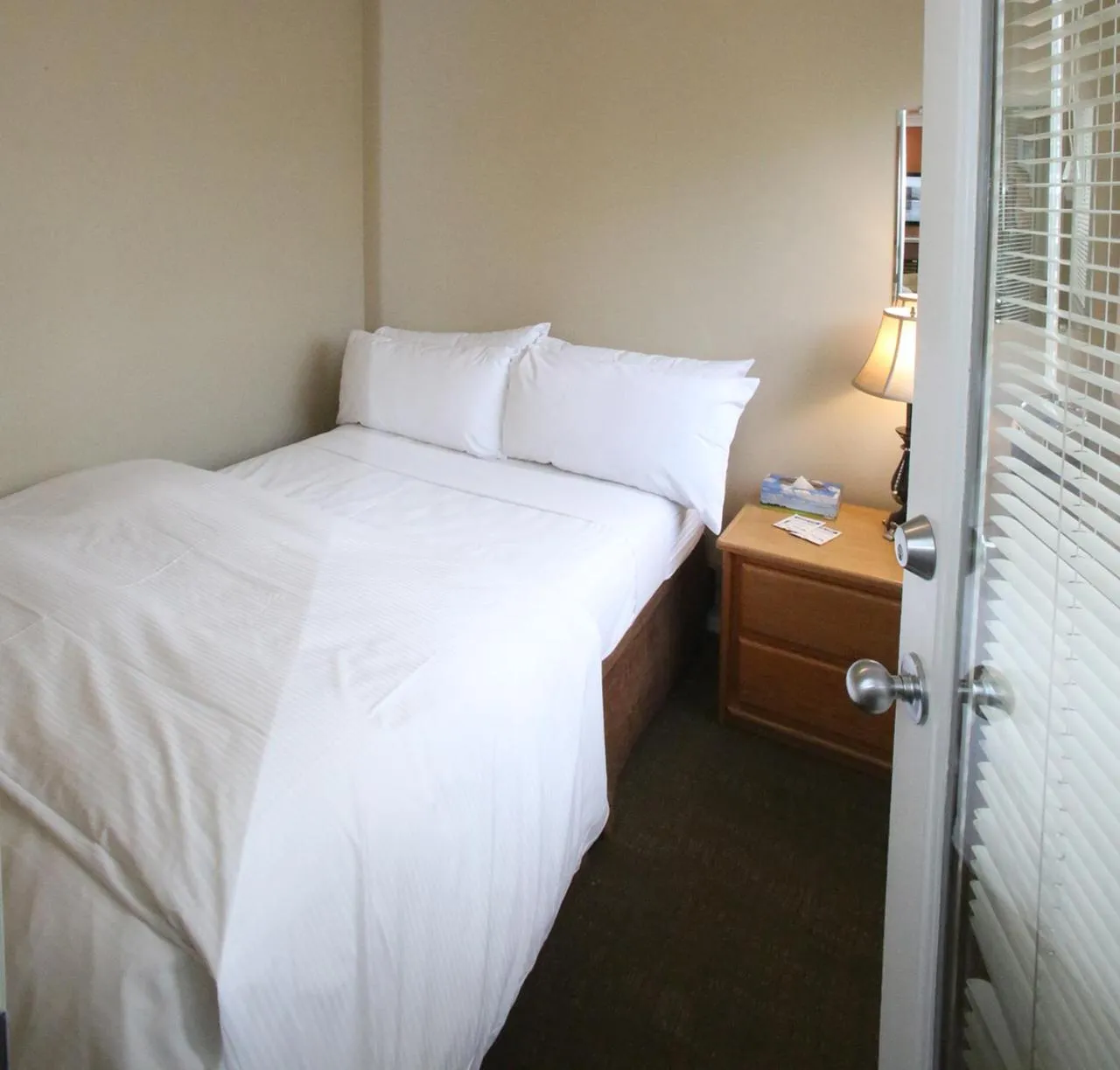 Bed in Times Square Suites Hotel