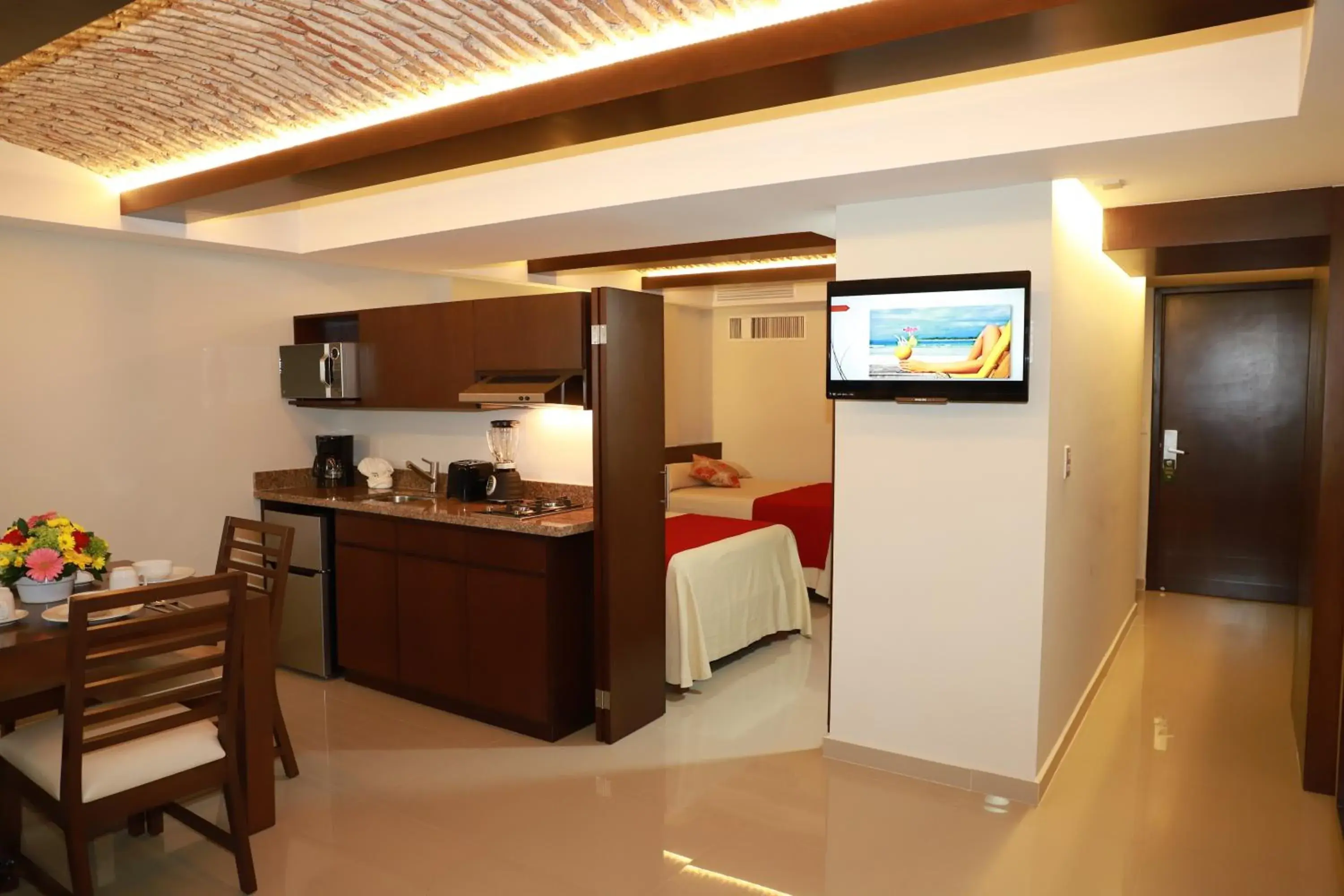 Property building, Bed in Las Flores Beach Resort Property building, Bed in Las Flores Beach Resort