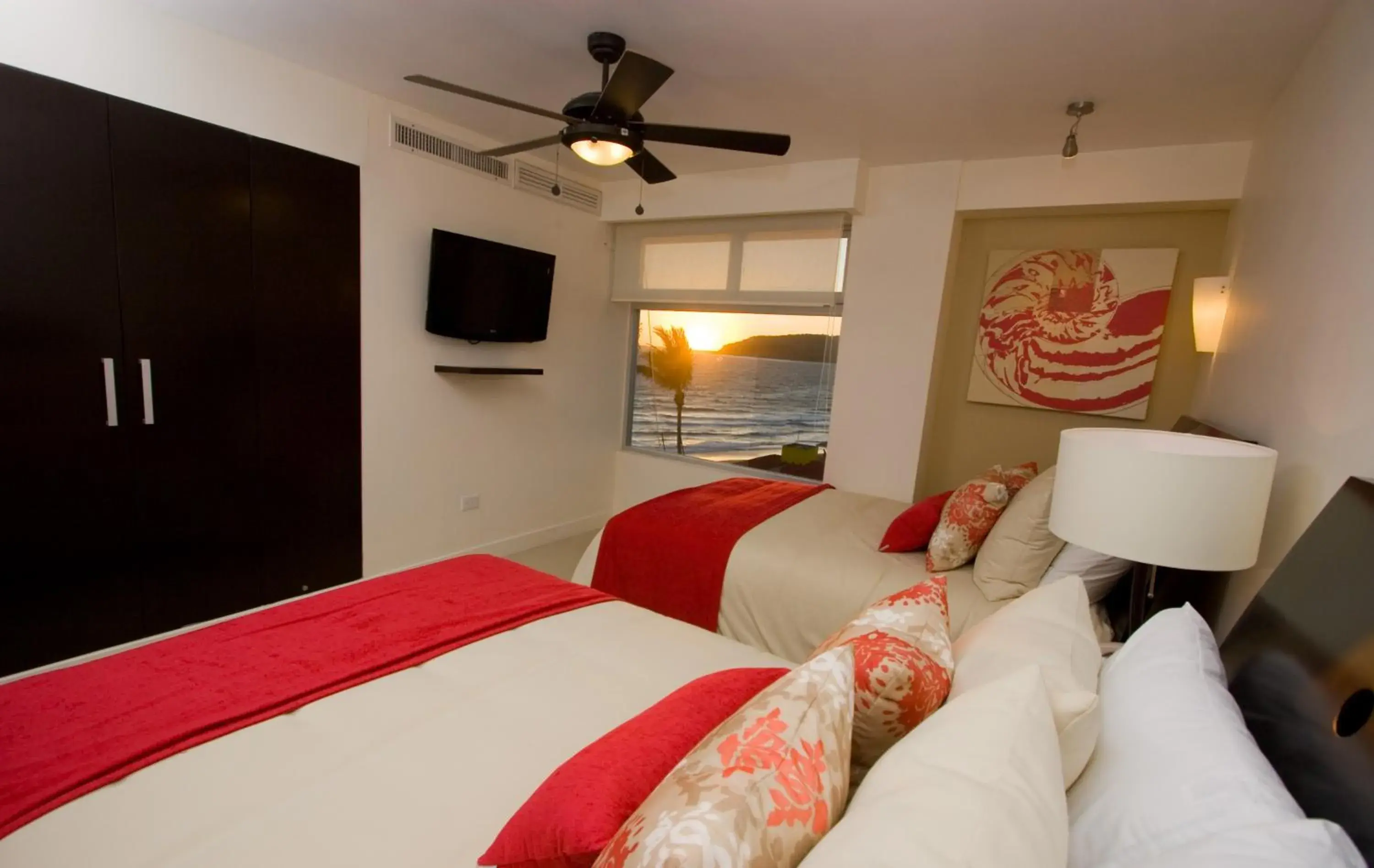 Property building, Bed in Las Flores Beach Resort Property building, Bed in Las Flores Beach Resort