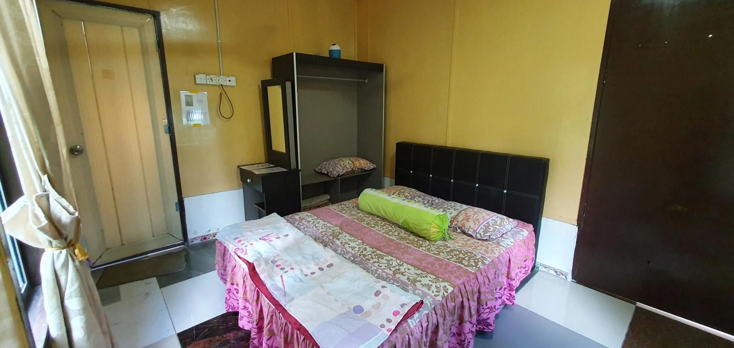 Bed in Chalet Kampong Semawar
