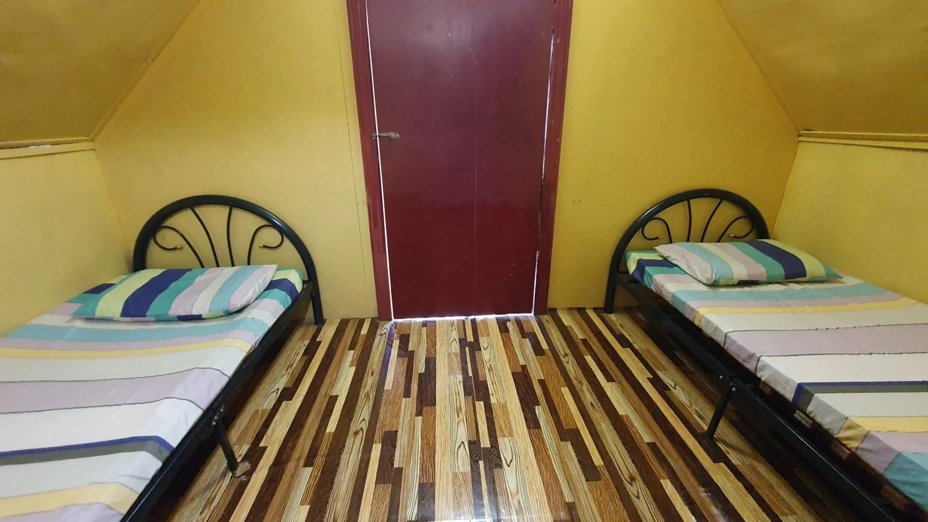 Bed in Chalet Kampong Semawar