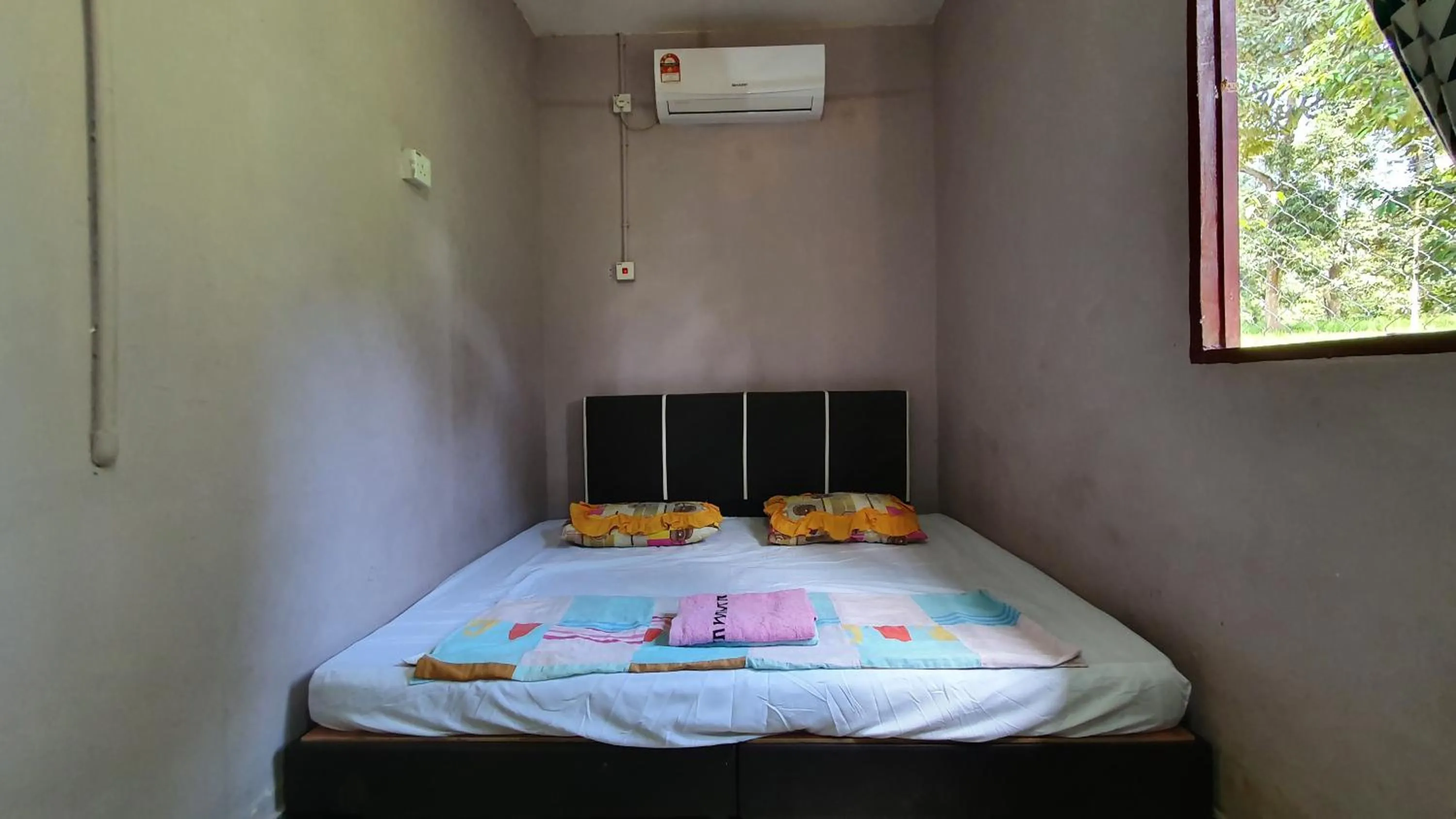 Bed in Chalet Kampong Semawar