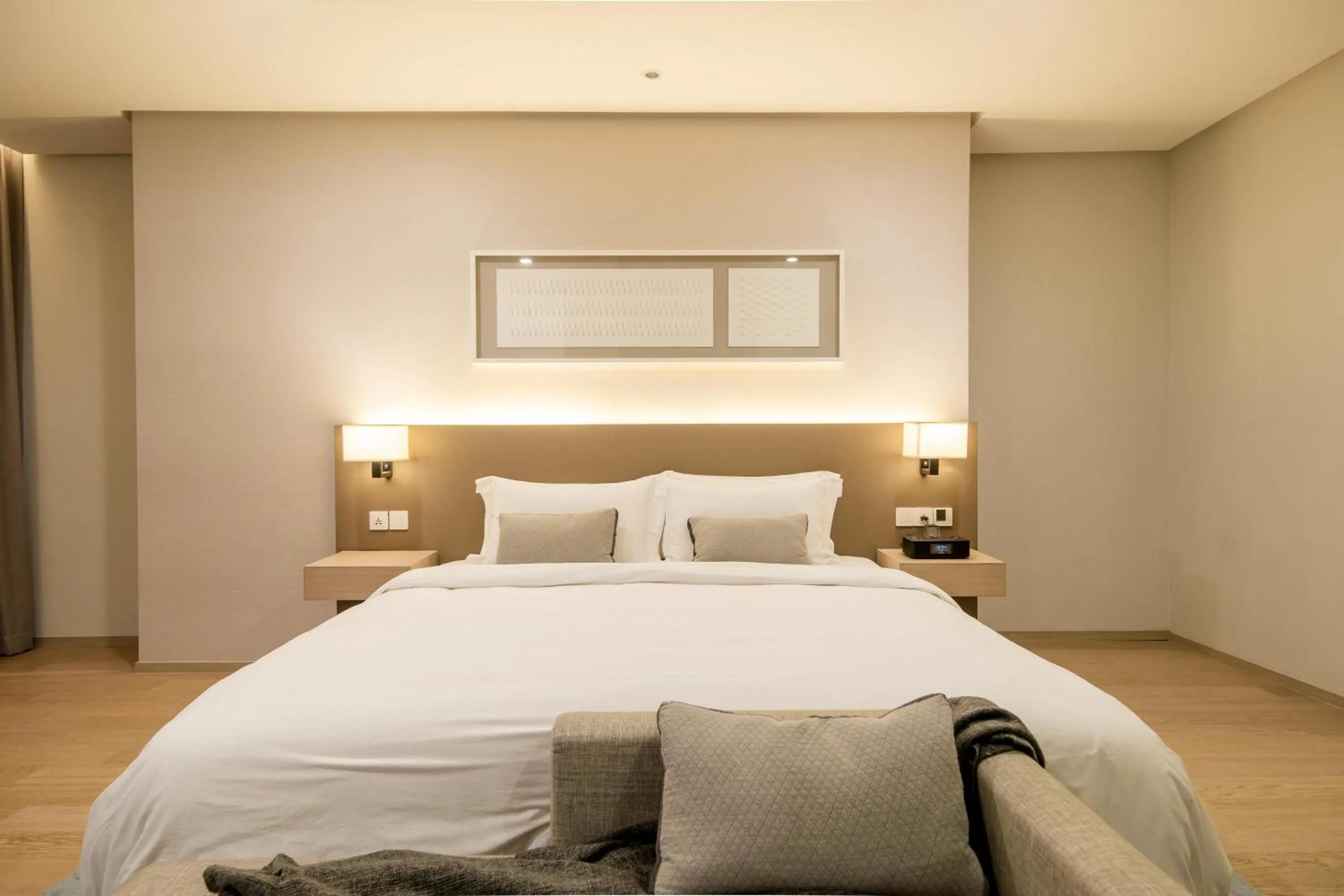 Bed in 188 Suites by NamaStay