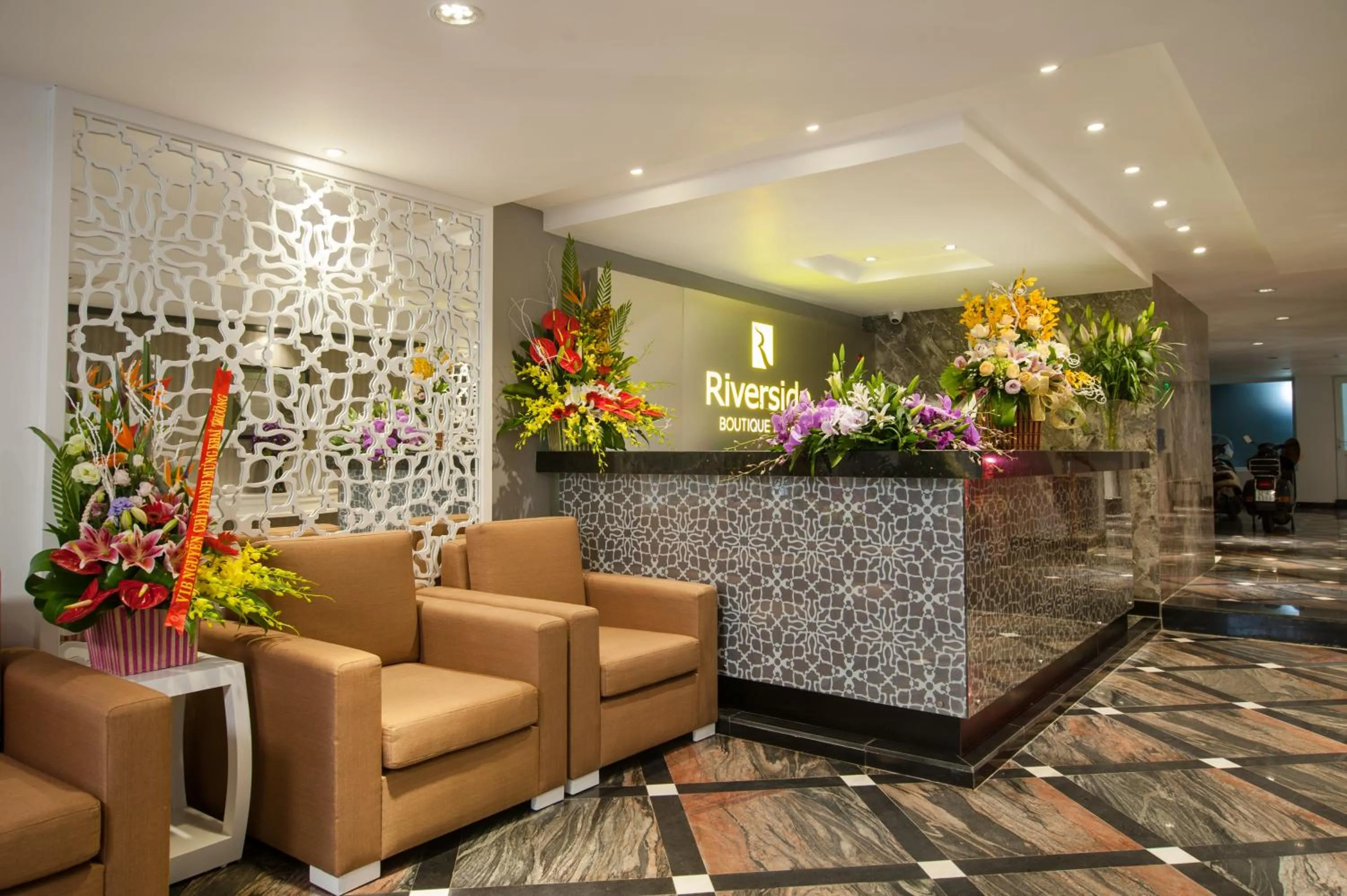 Communal lounge/ TV room in Riverside Boutique Hotel