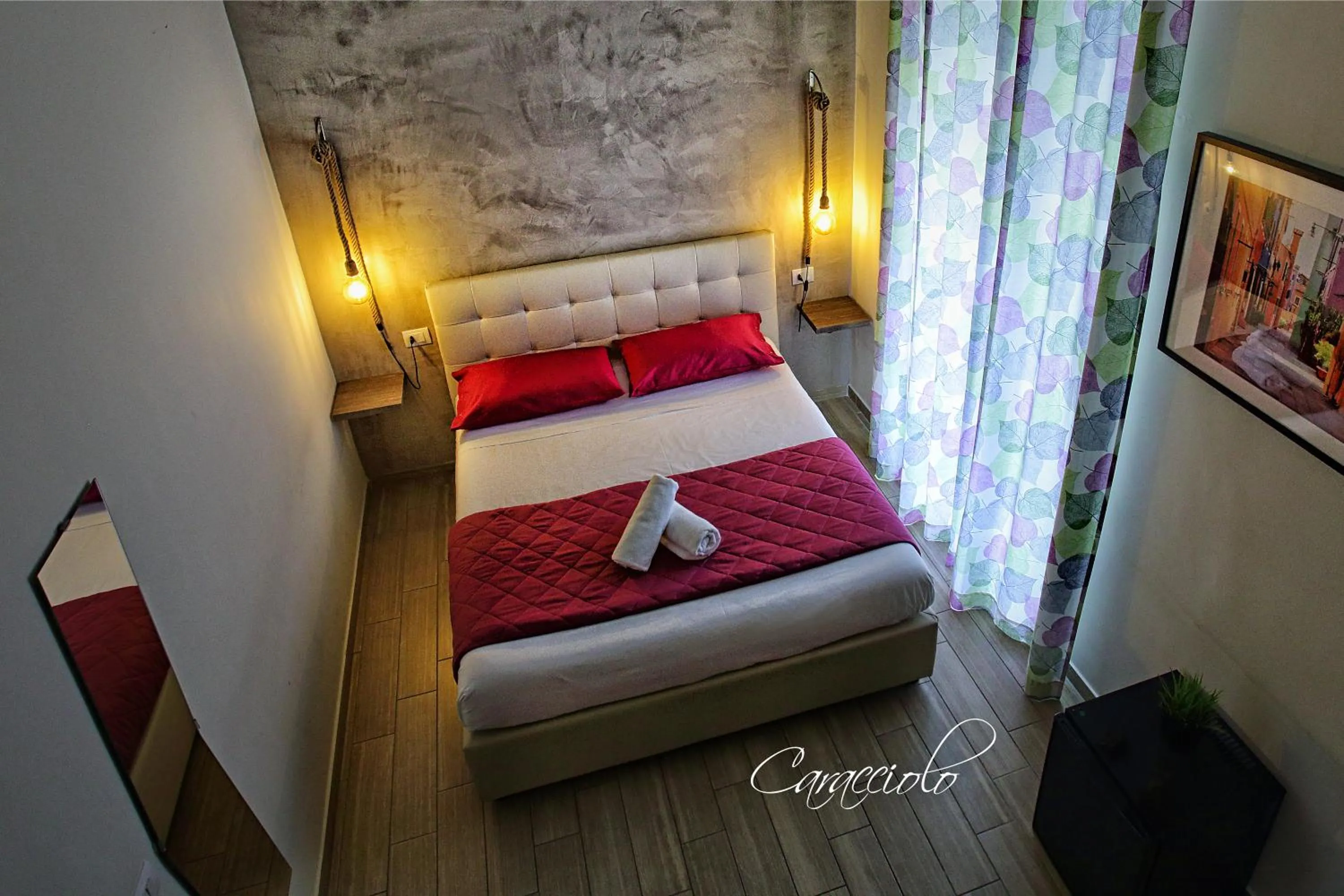 Bed in Napoli City Rooms