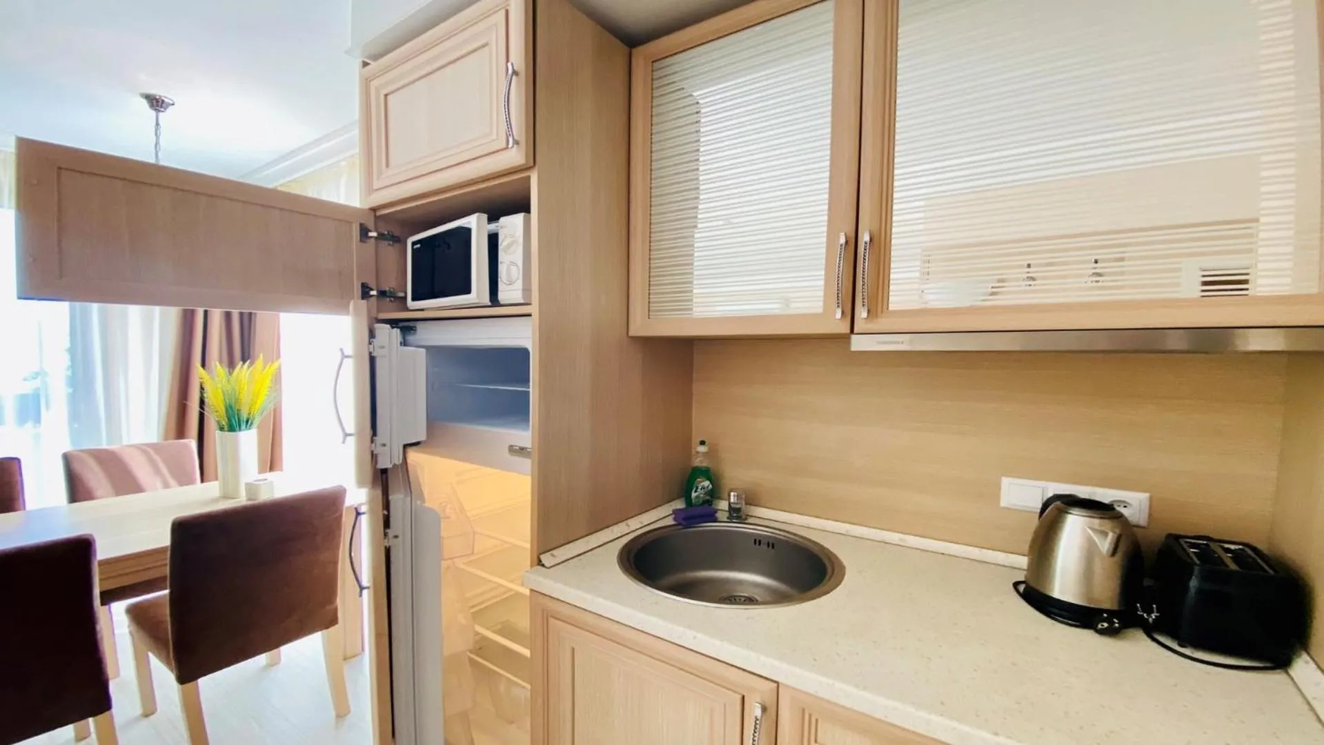 Kitchen or kitchenette in Bratanov Harmony Suites Dream Island Apartments