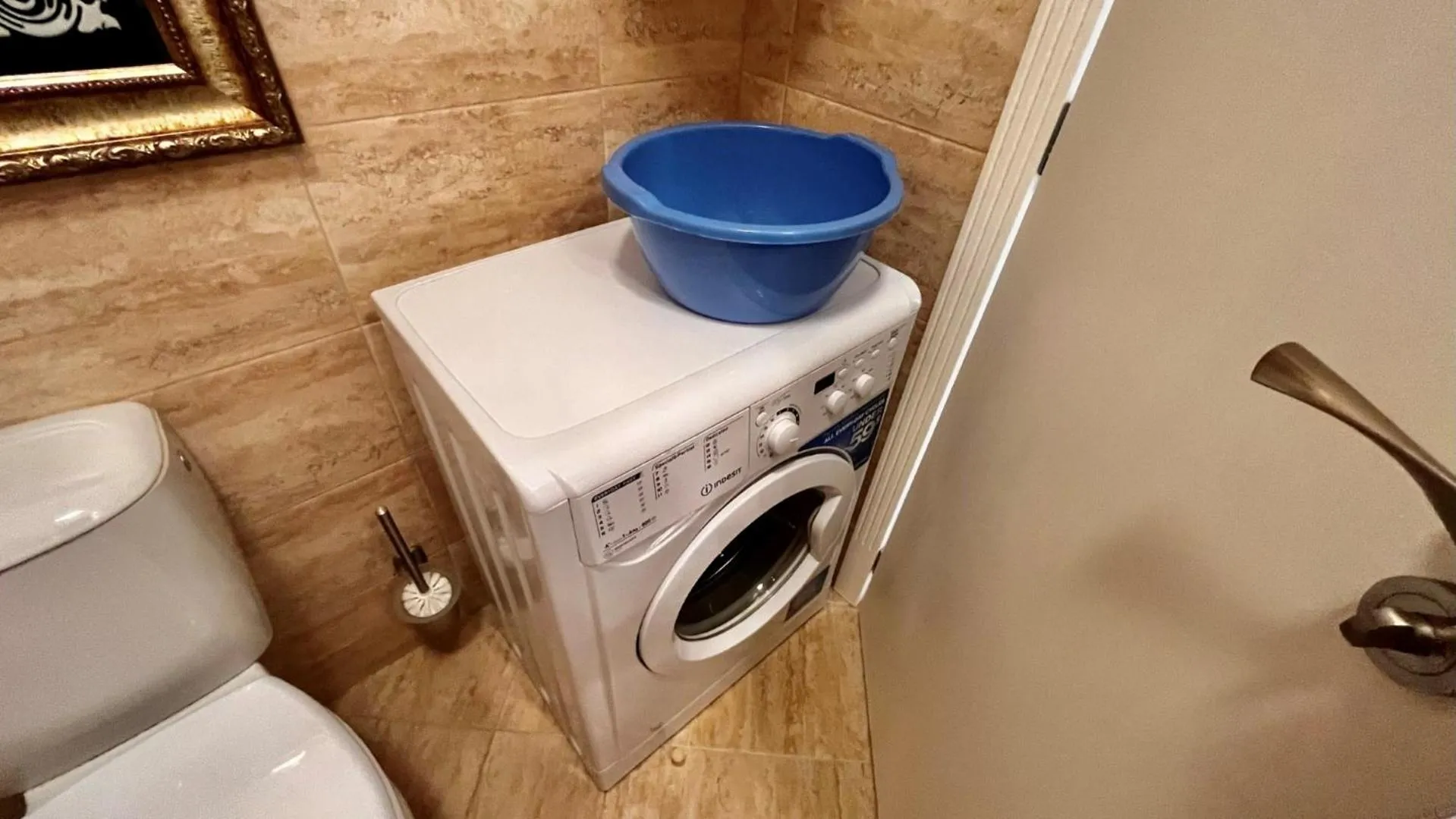 washing machine in Bratanov Harmony Suites Dream Island Apartments