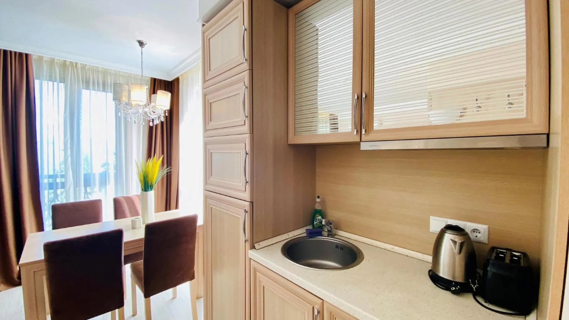 Kitchen or kitchenette in Bratanov Harmony Suites Dream Island Apartments