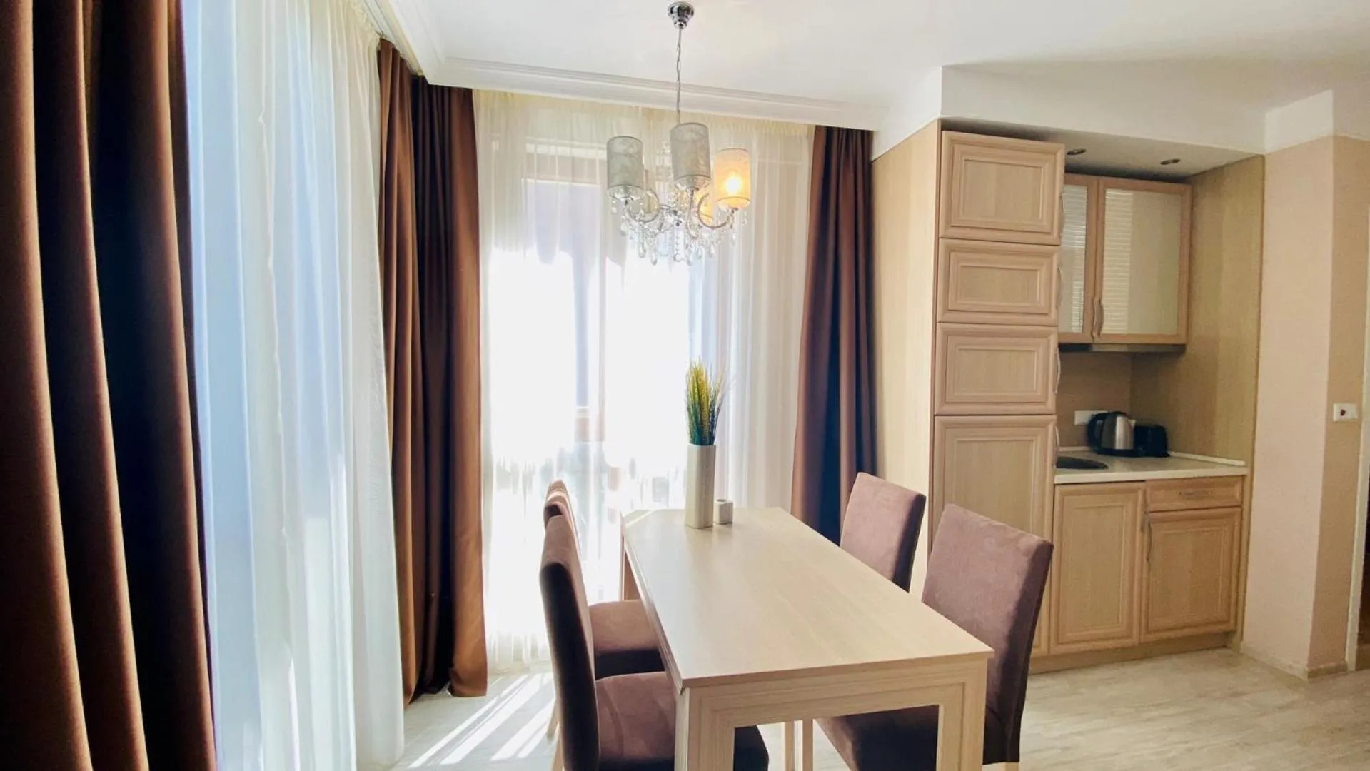 Kitchen or kitchenette in Bratanov Harmony Suites Dream Island Apartments