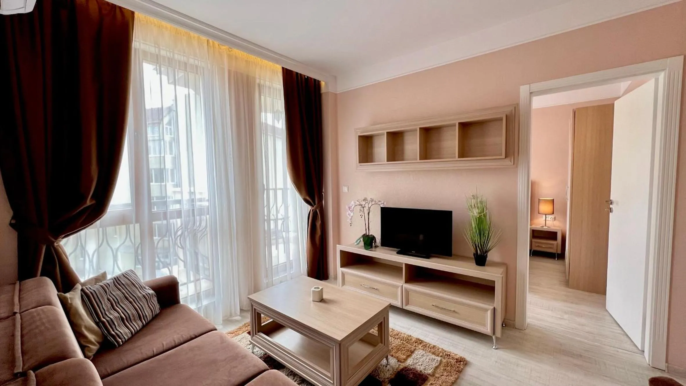 Communal lounge/ TV room in Bratanov Harmony Suites Dream Island Apartments
