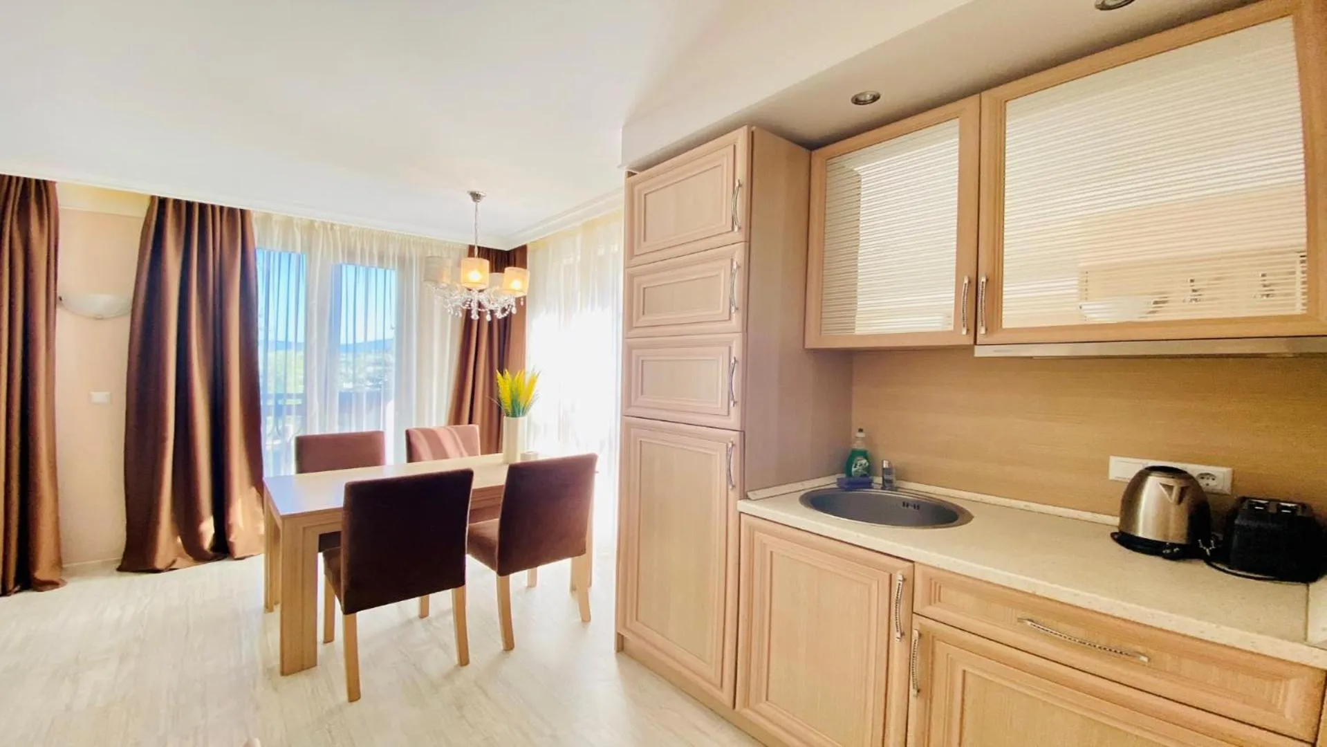 Communal lounge/ TV room in Bratanov Harmony Suites Dream Island Apartments