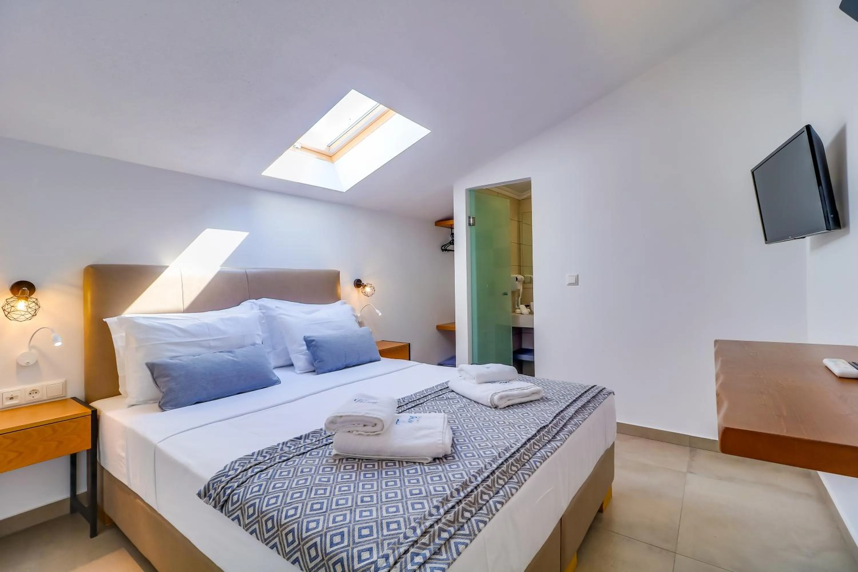 Bedroom in Theros Villas & Suites