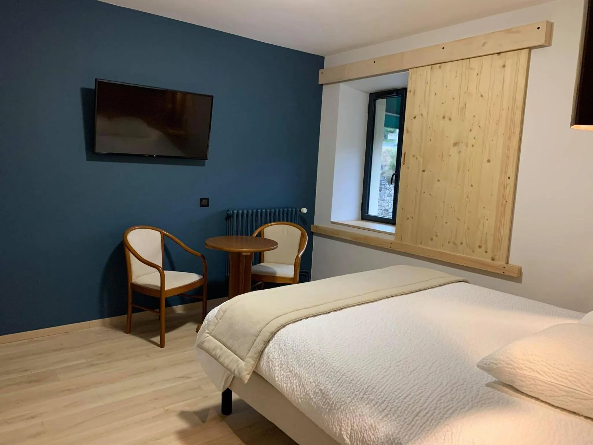 Bed in Logis Hotel Restaurant des Sapins