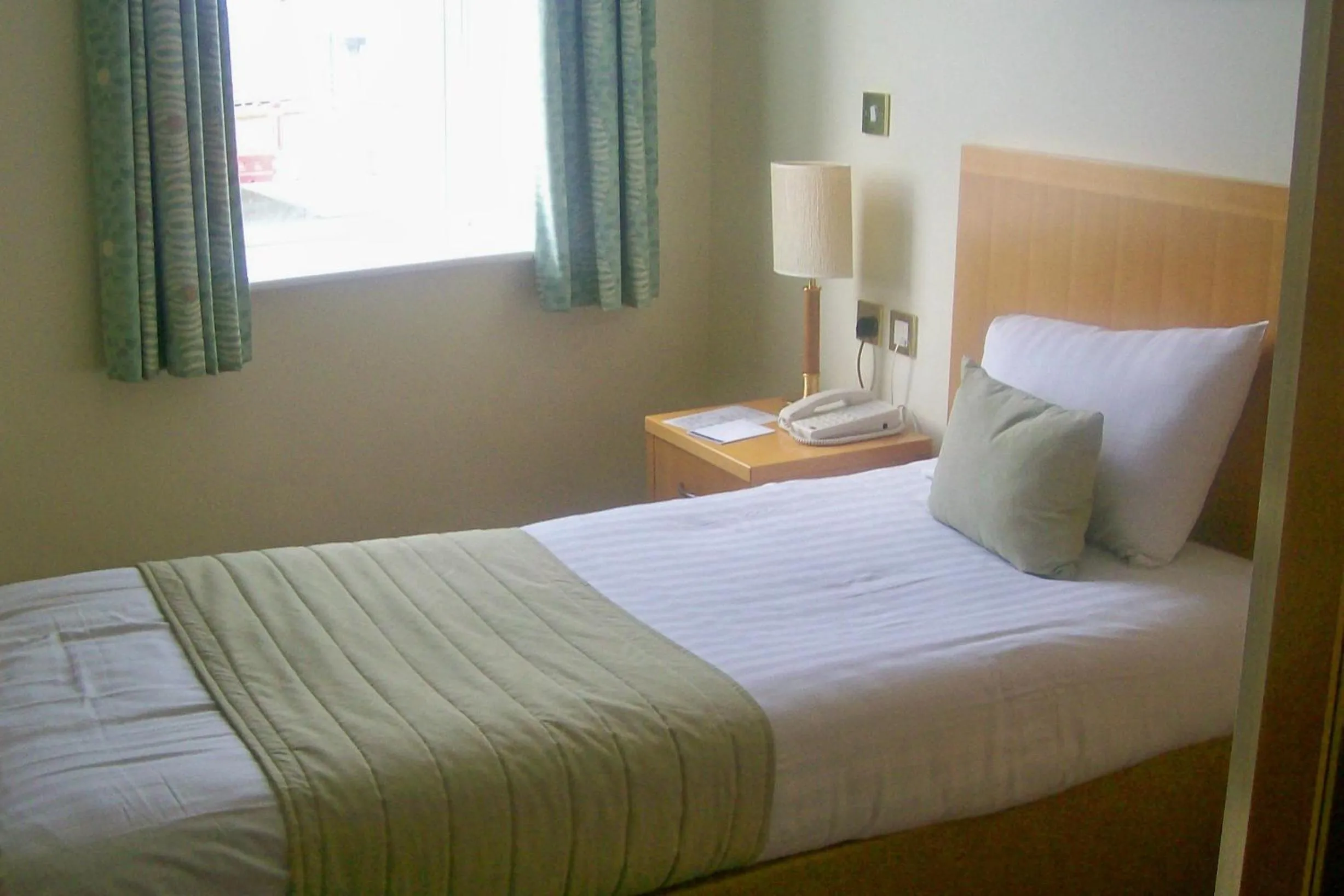 Bed in Carousel Hotel