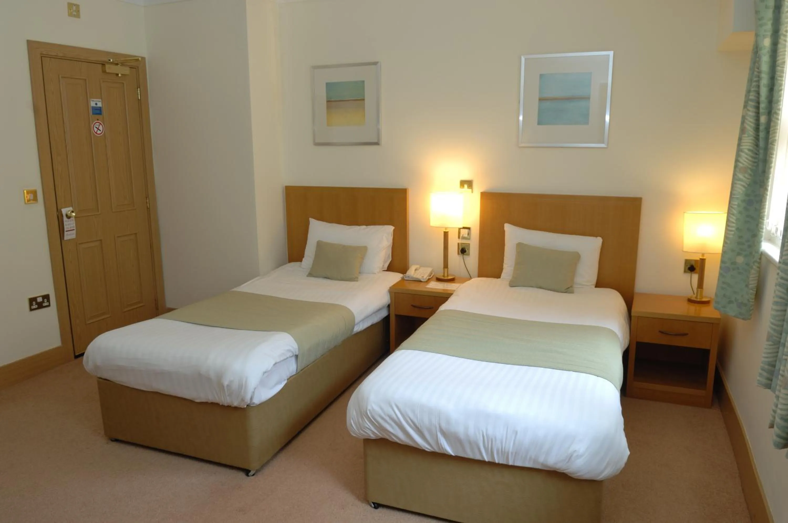 Bed in Carousel Hotel